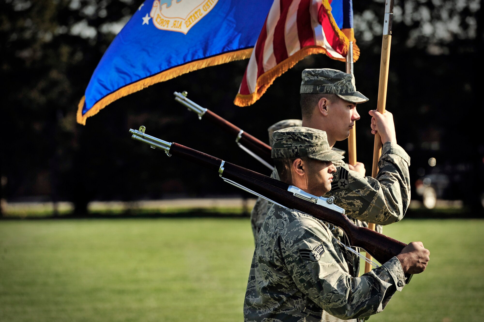 The Scott Air Force Base honor guard displays the colors during the Air Mobility Command change of command ceremony at Scott AFB, Nov. 30, 2012. Gen. Mark A. Welsh III presided over the transition from Gen. Raymond E. Johns Jr. to Gen. Paul J Selva. Johns served 35 years in the Air Force, commanding more than 130,000 Airmen as well as reaching 4,500 flight hours in various aircraft. The incoming AMC commander, Selva, was previously assigned as the assistant to the Chairman of the Joint Chiefs of Staff in Washington D.C. (U.S. Air Force photo/ Staff Sgt. Ryan Crane)