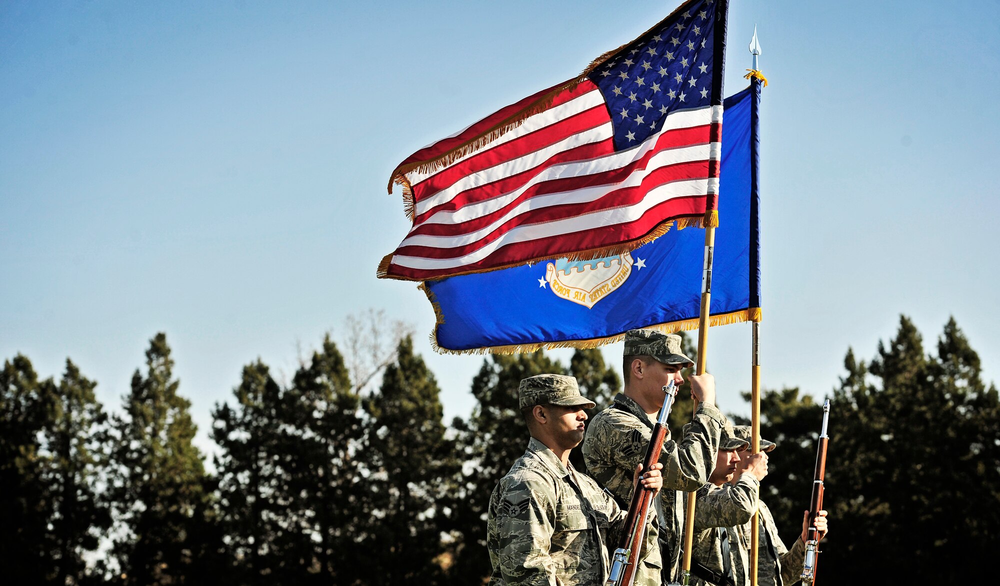 The Scott Air Force Base honor guard displays the colors during the Air Mobility Command change of command ceremony at Scott AFB, Nov. 30, 2012. Gen. Mark A. Welsh III presided over the transition from Gen. Raymond E. Johns Jr. to Gen. Paul J Selva. Johns served 35 years in the Air Force, commanding more than 130,000 Airmen as well as reaching 4,500 flight hours in various aircraft. The incoming AMC commander, Selva, was previously assigned as the assistant to the Chairman of the Joint Chiefs of Staff in Washington D.C. (U.S. Air Force photo/ Staff Sgt. Ryan Crane)