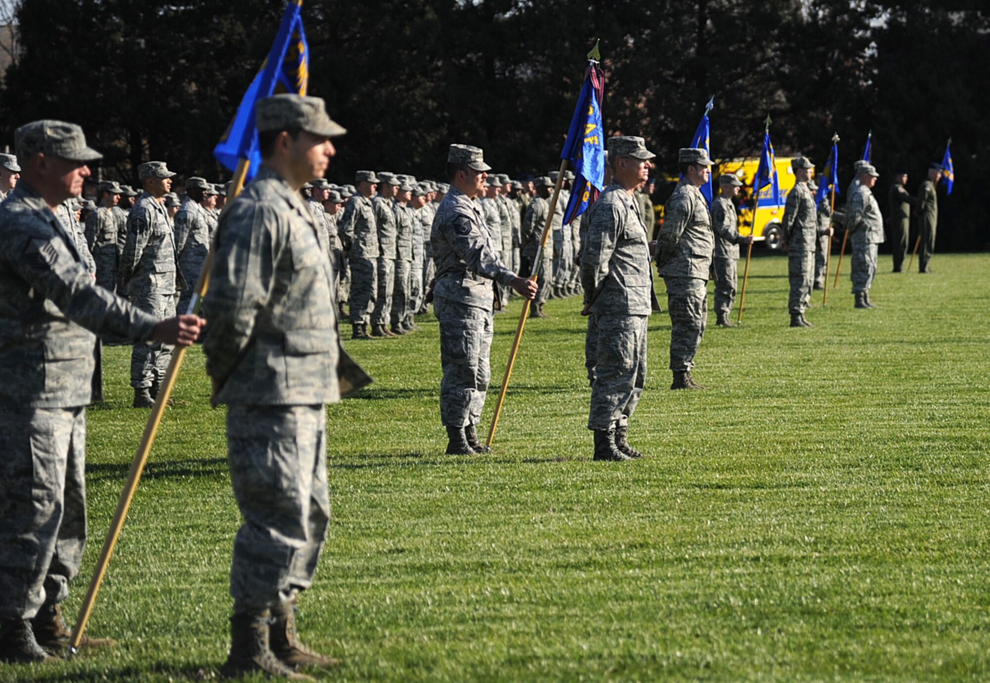 Members of Scott Air Force base stand at parade rest before a pass and review at the Air Mobility Command change of command ceremony during the change of command ceremony at Scott Air Force Base Nov. 30, 2012. The outgoing commander, Gen. Raymond E. Johns Jr. served 35 years in the Air Force, commanding more than 130,000 Airmen as well as reaching 4,500 flight hours in various aircraft. (U.S. Air Force photo/ Senior Airman Tristin English)