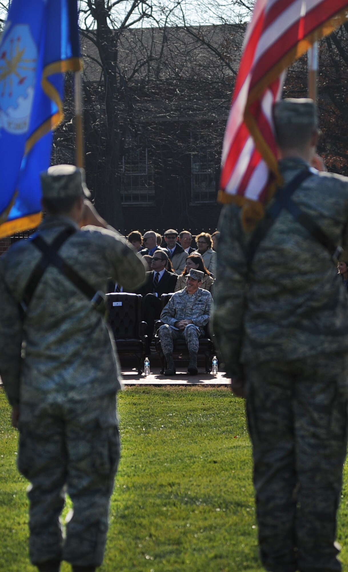 Gen. Raymond E. Johns Jr., Air Mobility Command commander listens to stories about his command position during the change of command ceremony at Scott Air Force Base Nov. 30, 2012. Johns served 35 years in the Air Force, commanding more than 130,000 Airmen as well as reaching 4,500 flight hours in various aircraft. The incoming AMC commander, Gen. Paul J. Selva, was previously assigned as the assistant to the Chairman of the Joint Chiefs of Staff in Washington D.C. (U.S. Air Force photo/ Senior Airman Tristin English)