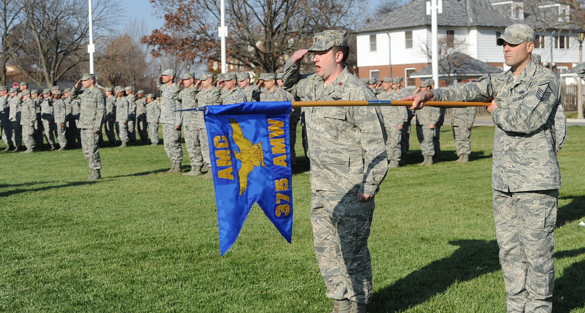 Members of Scott Air Force base present their guidon at the Air Mobility Command change of command ceremony during the change of command ceremony at Scott Air Force Base Nov. 30, 2012. The outgoing commander, Gen. Raymond E. Johns Jr. served 35 years in the Air Force, commanding more than 130,000 Airmen as well as reaching 4,500 flight hours in various aircraft. (U.S. Air Force photo/ Senior Airman Tristin English)
