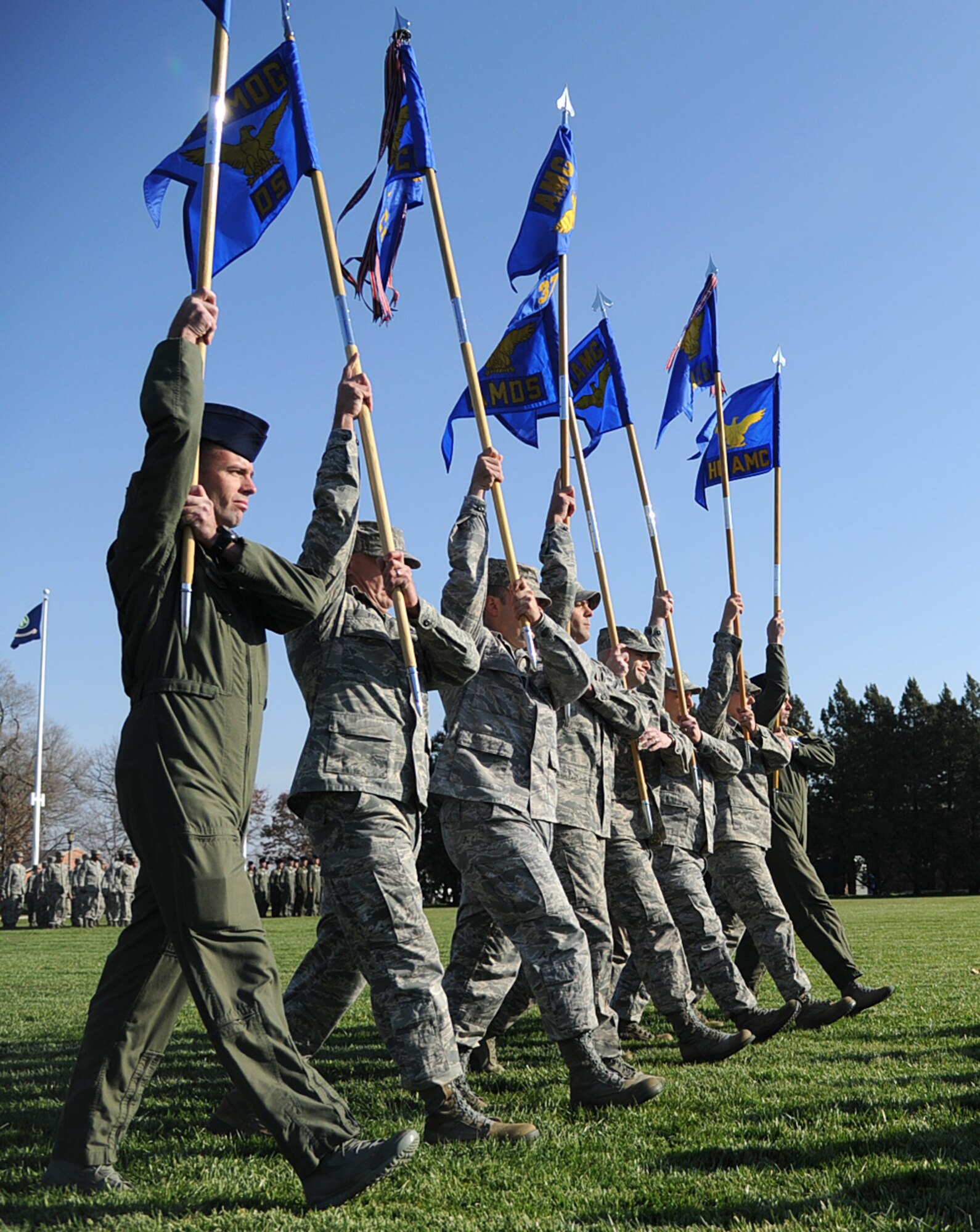Members  of Scott Air Force base present their guidon at the Air Mobility Command change of command ceremony during the change of command ceremony at Scott Air Force Base Nov. 30, 2012. The outgoing commander, Gen. Raymond E. Johns Jr. served 35 years in the Air Force, commanding more than 130,000 Airmen as well as reaching 4,500 flight hours in various aircraft. (U.S. Air Force photo/ Senior Airman Tristin English)