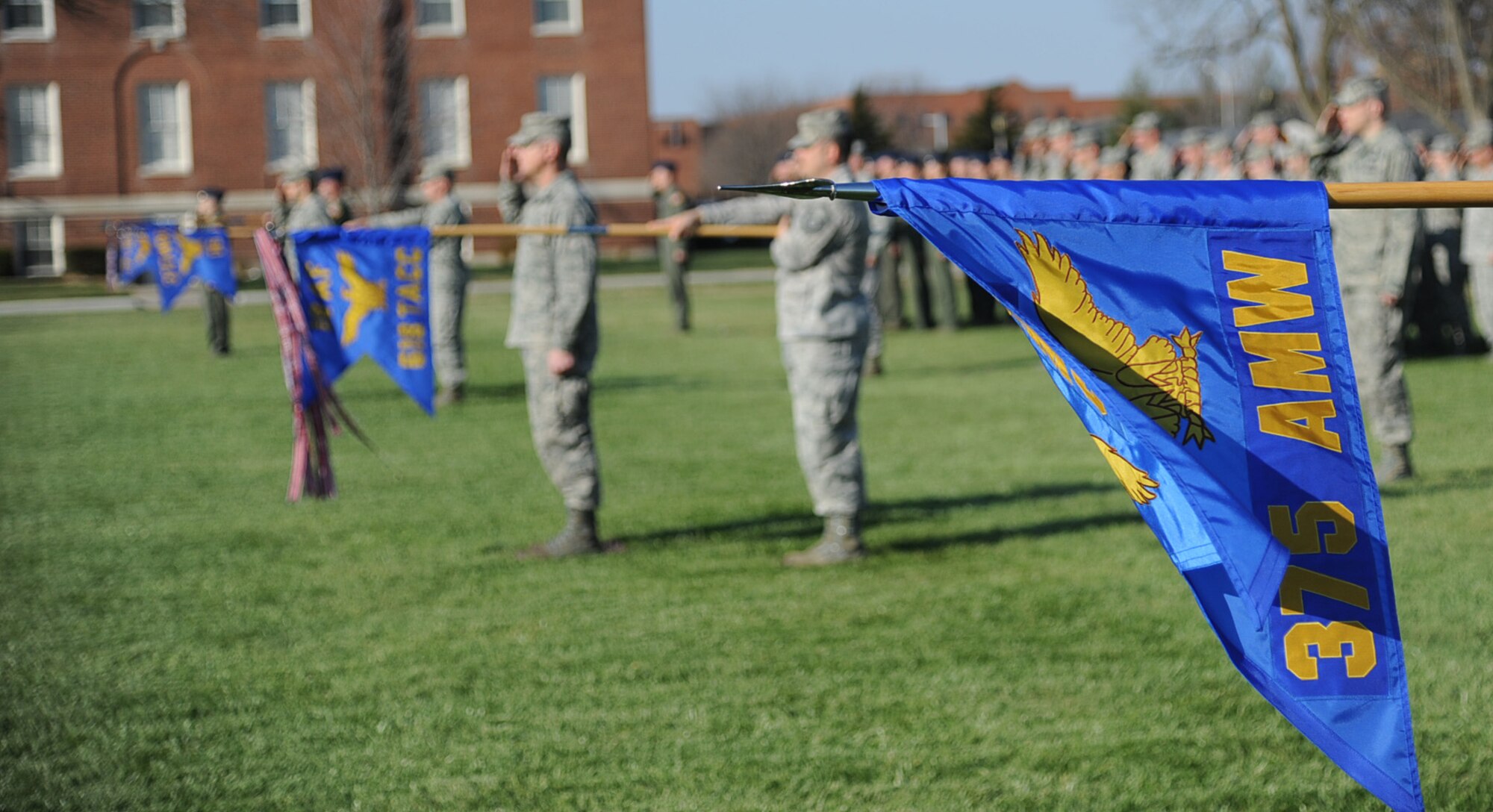Members  of Scott Air Force base present their guidon at the Air Mobility Command change of command ceremony during the change of command ceremony at Scott Air Force Base Nov. 30, 2012. The outgoing commander, Gen. Raymond E. Johns Jr. served 35 years in the Air Force, commanding more than 130,000 Airmen as well as reaching 4,500 flight hours in various aircraft. (U.S. Air Force photo/ Senior Airman Tristin English)
