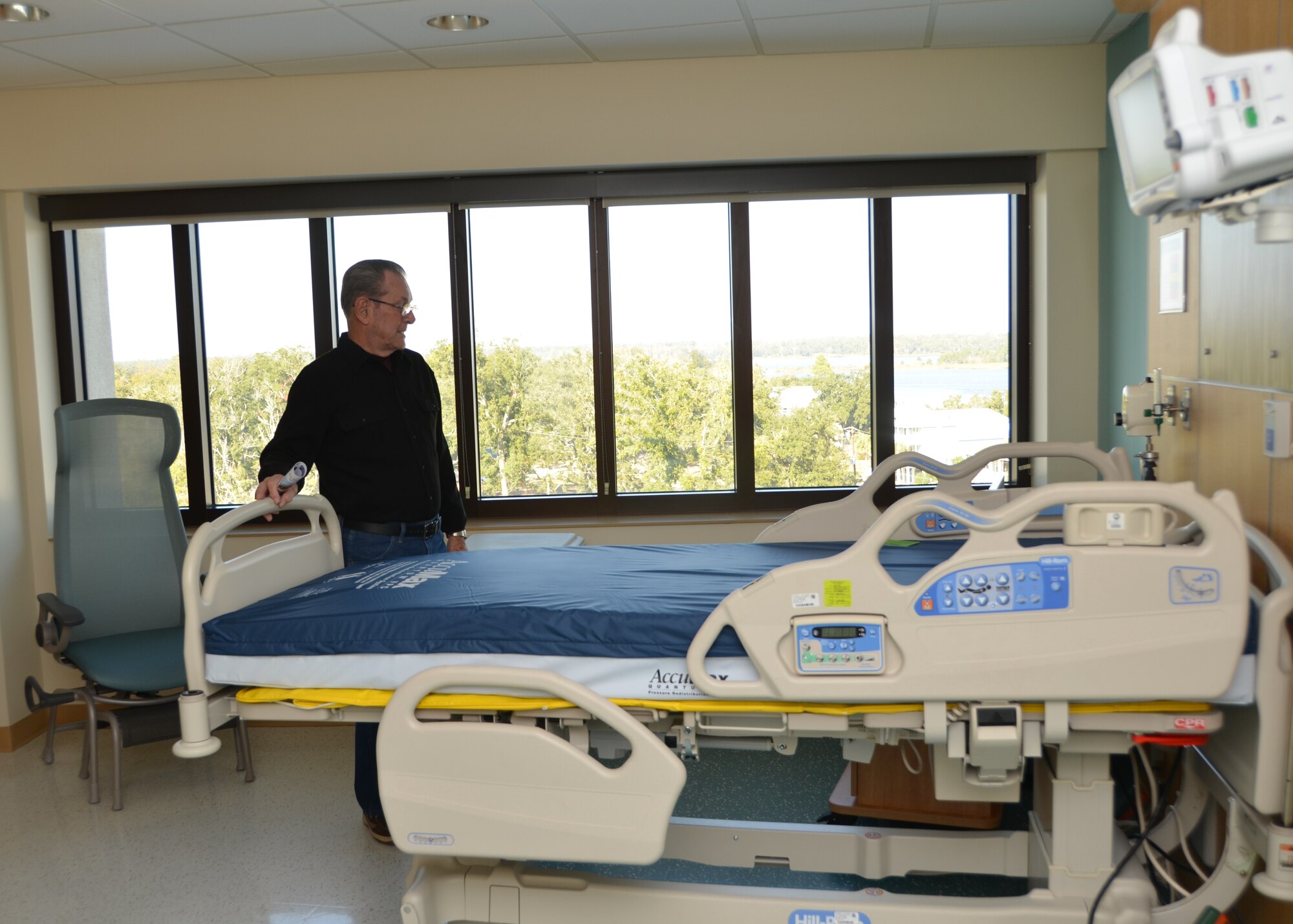 Retired Chief Master Sgt. J.J. Vollmuth visits a patient room in Keesler Hospital’s new Back Bay Tower as he toured the facility during an afternoon open house Nov. 29, 2012 at Keesler Air Force Base, Miss. The tour was for those enrolled with the hospital and staff members.  Departments that will be located in the tower begin moving in the week of Dec. 3 and it will be open to patient care about mid-month.  (U.S. Air Force photo by Steve Pivnick)