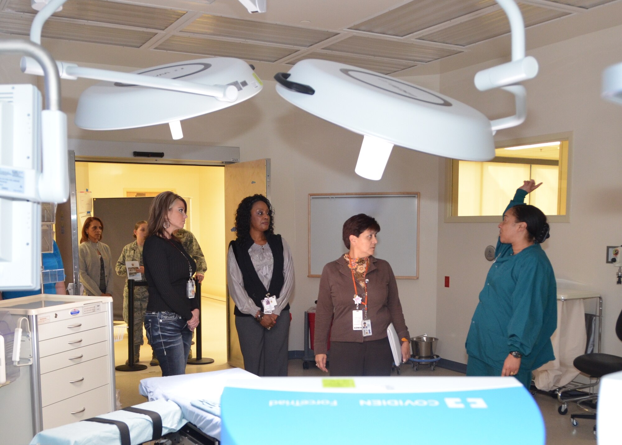 Lt. Col. Nneka Williams, 81st Surgical Operations Squadron Operating Room Flight commander, right, describes equipment in one of the operating rooms in Keesler Hospitals new Back Bay Tower to hospital staff members, from left, Kathleen Meschberger and Linda Davis, 81st Medical Support Squadron, and Martha Prieto-Moreno, 81st Medical Group.  They were touring the new facility during an afternoon open house Nov. 29, 2012 at Keesler Air Force Base, Miss. for those enrolled with the hospital and staff members.  Departments that will be located in the tower begin moving in the week of Dec. 3 and it will be open for patient care about mid-month.  (U.S. Air Force photo by Steve Pivnick)