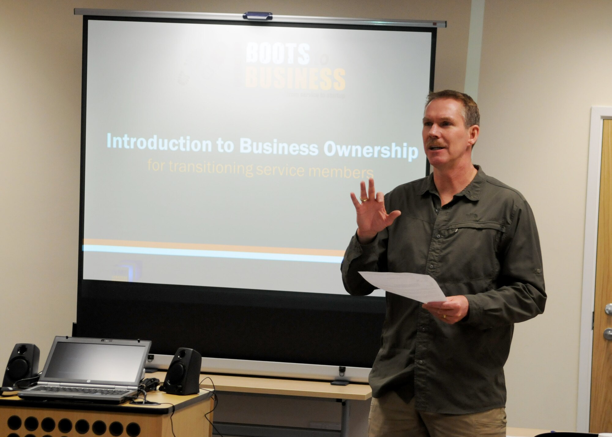 Chief Master Sgt. Christopher Powell, 100th Air Refueling Wing command chief, speaks at the opening of Boots to Business Nov. 28, 2012, at RAF Mildenhall, England.  The program is designed to assist separating military members in developing an “actionable” plan for subsequent efforts focused on launching a new venture.  (U.S. Air Force photo by Staff Sgt. Tabitha M. Lee/Released)