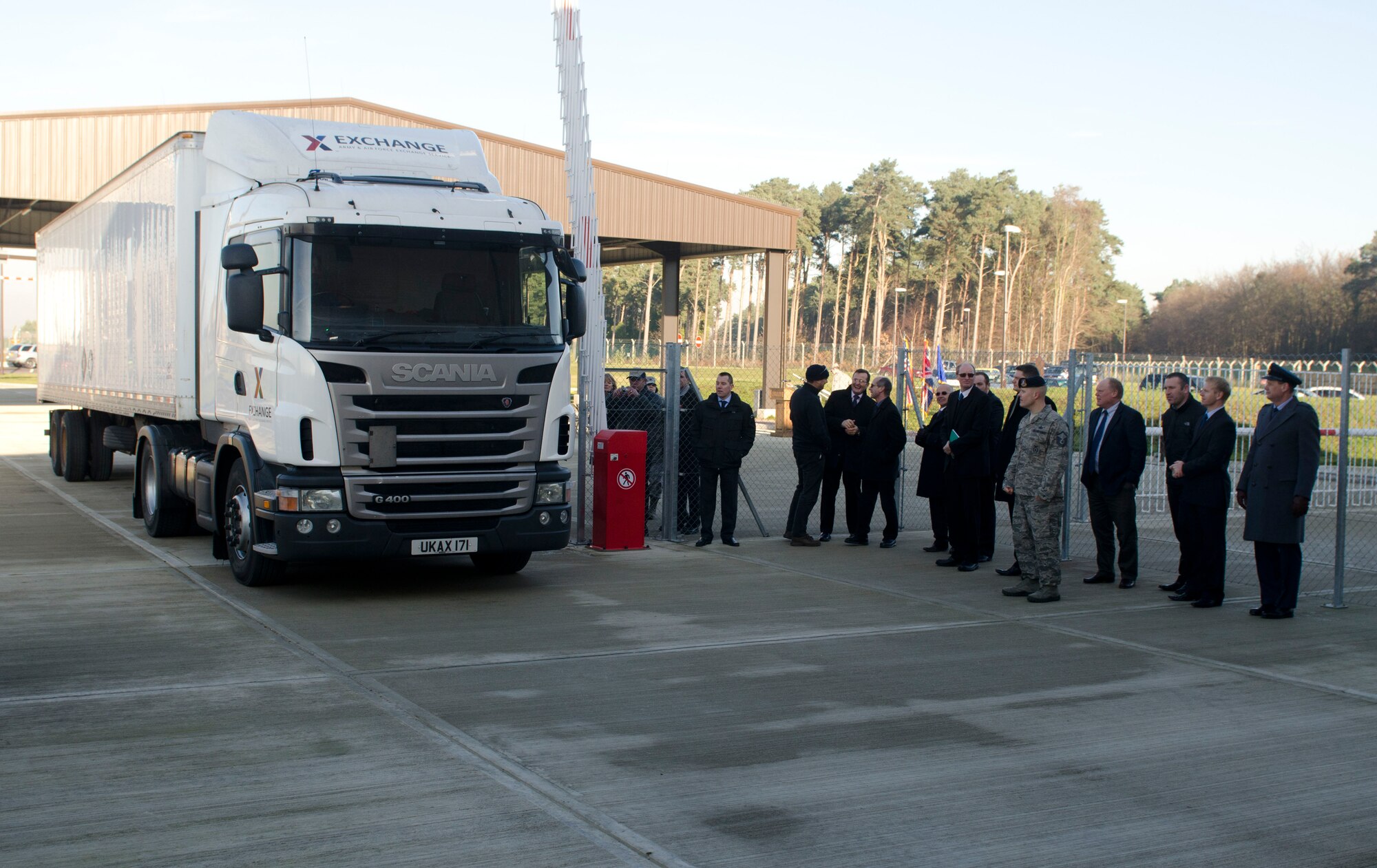 ROYAL AIR FORCE LAKENHEATH, England - A truck and trailer becomes the first vehicle to utilize the Large Vehicle Inspection Site after a ribbon-cutting ceremony Nov. 30, 2012. The LVIS, a new gate specifically for large vehicles entering RAF Lakenheath will be open Monday through Friday from 6 a.m. to 6 p.m. beginning Dec. 3. (U.S. Air Force photo by Staff Sgt. Stephen Linch)