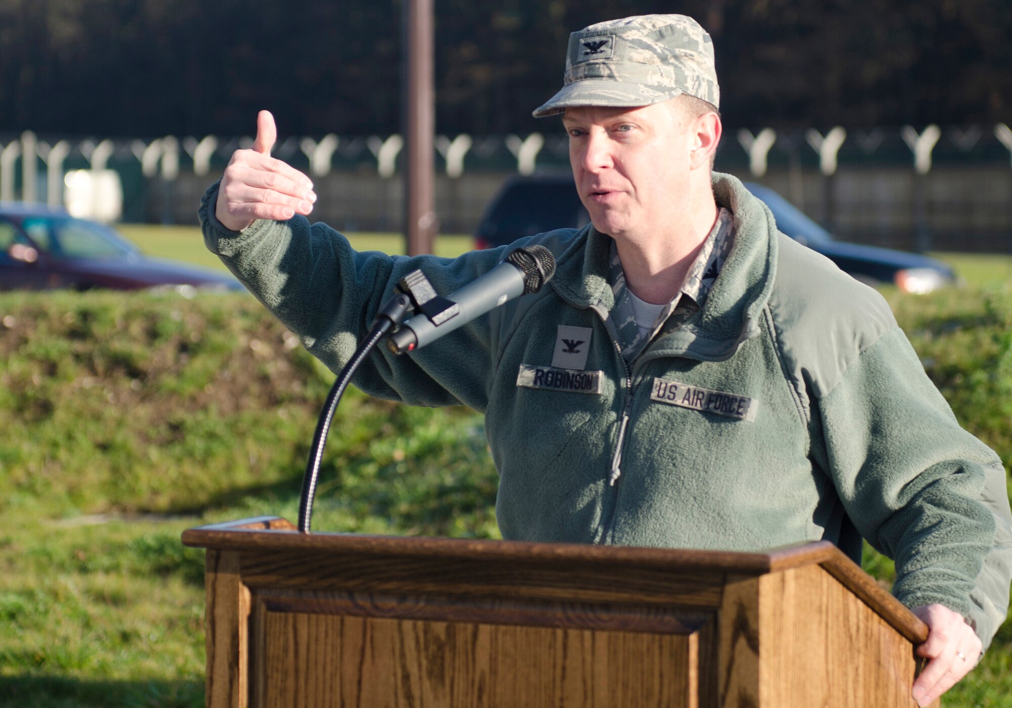 ROYAL AIR FORCE LAKENHEATH, England - Col. Kyle Robinson, 48th Fighter Wing commander, speaks about the impact the new Large Vehicle Inspection Site gate will have during its ribbon-cutting ceremony Nov. 30, 2012. The LVIS, a new gate specifically for large vehicles entering RAF Lakenheath will be open Monday through Friday from 6 a.m. to 6 p.m. beginning Dec. 3. (U.S. Air Force photo by Staff Sgt. Stephen Linch)