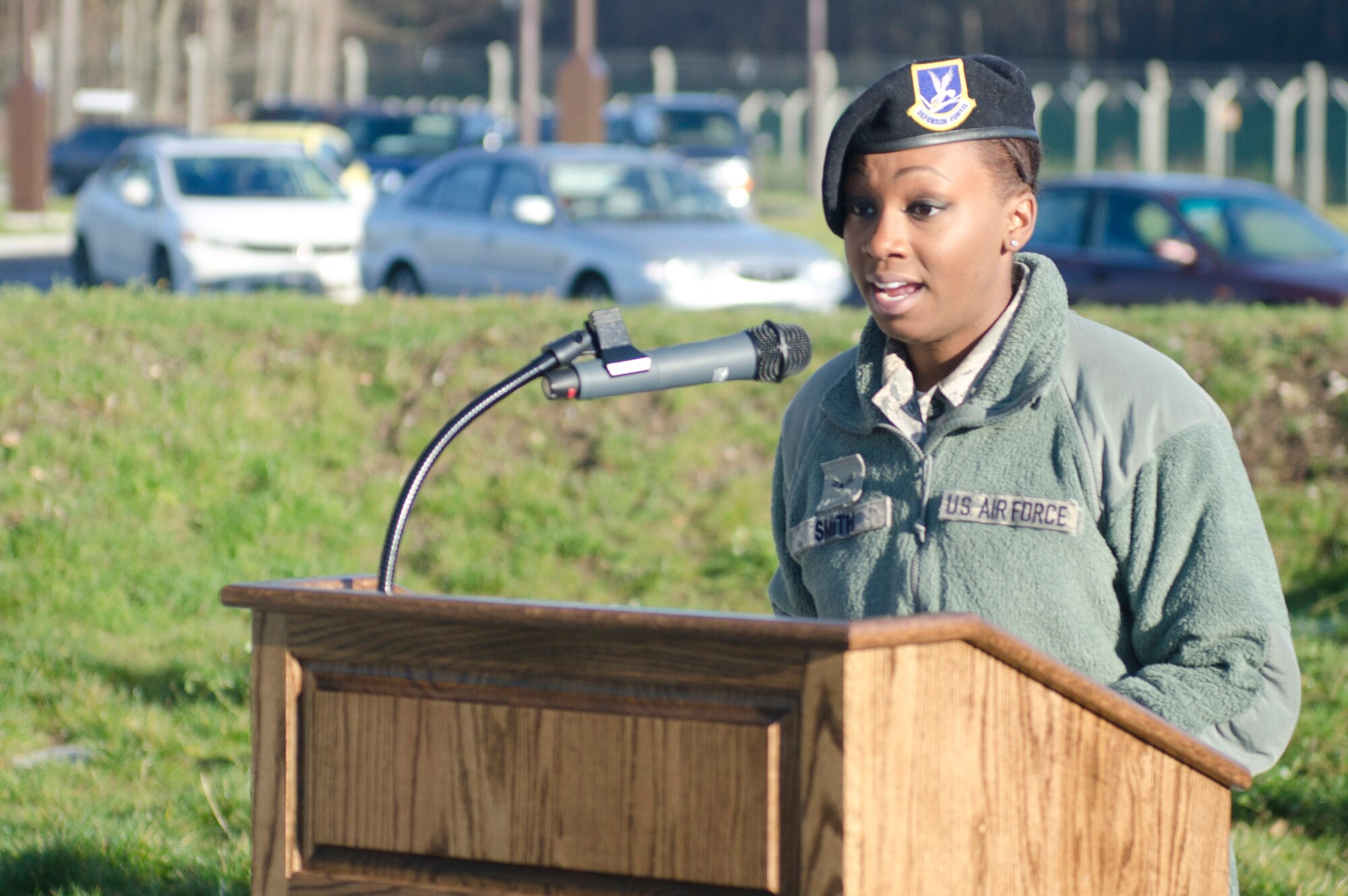 ROYAL AIR FORCE LAKENHEATH, England - Airman 1st Class Alexandria Smith, 48th Security Forces Squadron pass and registration clerk, welcomes guests to the Large Vehicle Inspection Site ribbon-cutting ceremony Nov. 30, 2012. The LVIS, a new gate specifically for large vehicles entering RAF Lakenheath will be open Monday through Friday from 6 a.m. to 6 p.m. beginning Dec. 3. (U.S. Air Force photo by Staff Sgt. Stephen Linch)