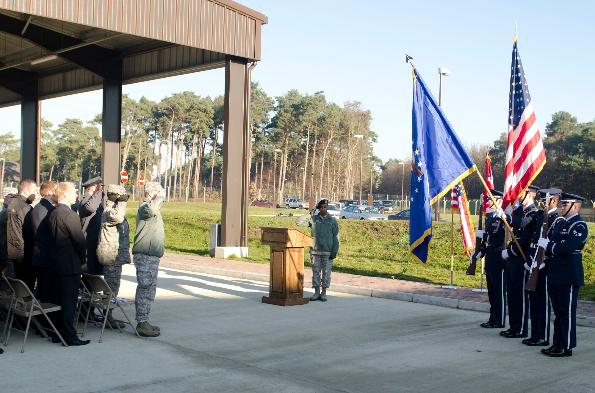 ROYAL AIR FORCE LAKENHEATH, England - The RAF Lakenheath Honor Guard presents the colors during the Large Vehicle Inspection Site ribbon-cutting ceremony Nov. 30, 2012. The LVIS, a new gate specifically for large vehicles entering RAF Lakenheath will be open Monday through Friday from 6 a.m. to 6 p.m. beginning Dec. 3. (U.S. Air Force photo by Staff Sgt. Stephen Linch)