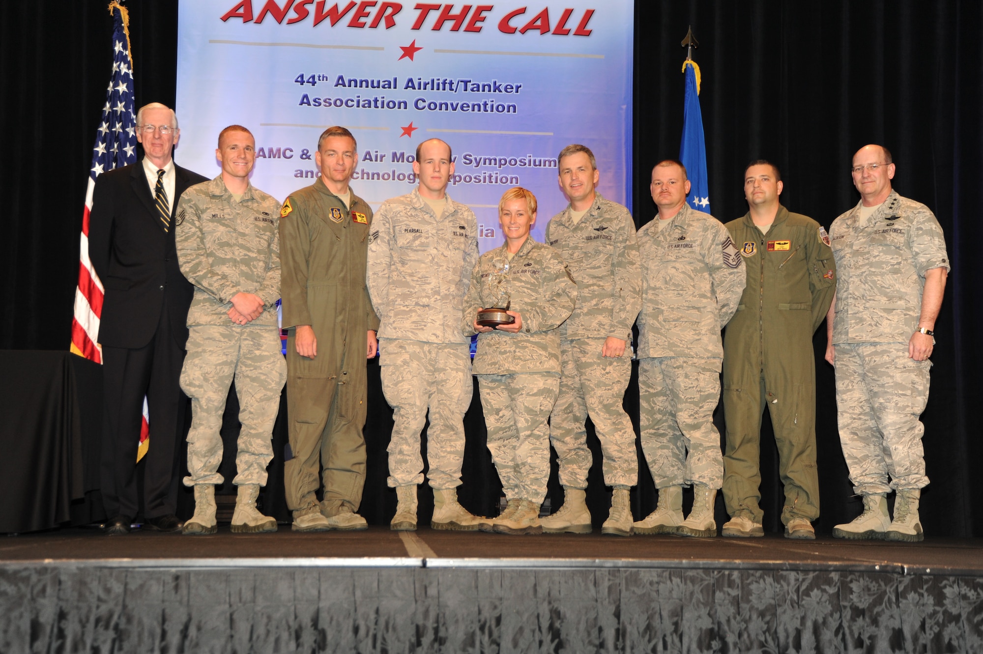 From left, retired Gen. Walter Kross; Staff Sgt. Robert Mills, 507th Maintenance Squadron; Senior Master Sgt. Darby Perrin, 465th Operations Support Flight; Senior Airman Mathew Pearsall, 507th Aircraft Maintenance Squadron; Master Sgt. Amy Preskitt, 507th Civil Engineering Squadron; Col. Kevin Trayer, 507th Air Refueling Wing vice commander; Chief Master Sgt. David Dickson, 507th Mission Support Group; Tech. Sgt. Jeff Bass, 507th Aircraft Generation Squadron; and Lt. Gen. James Jackson, Air Force Reserve commander. (Air Force photo)