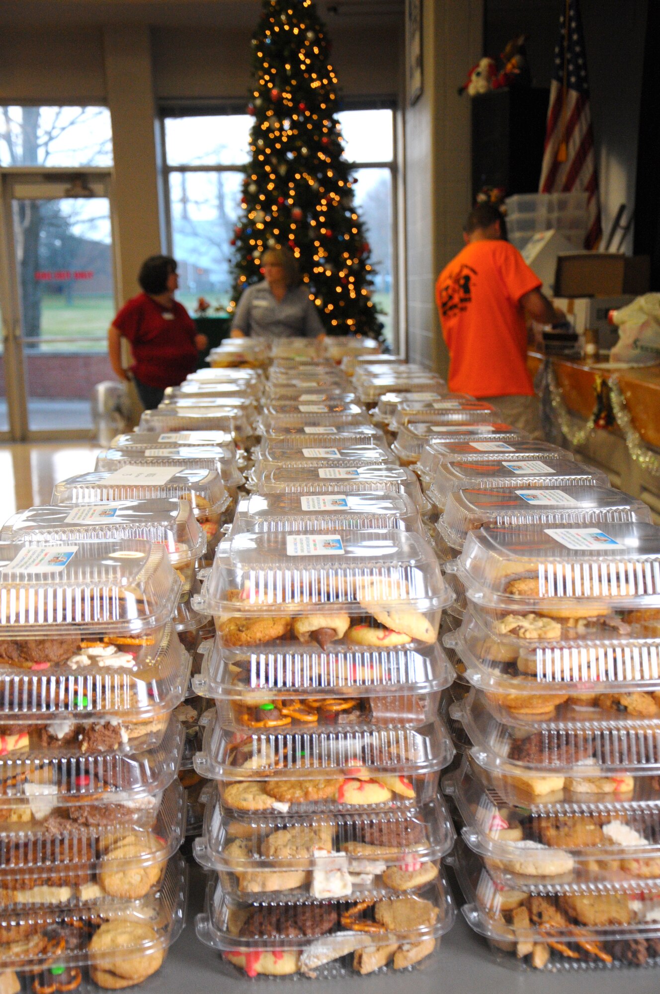 Cookies and other treats baked by members of the Wright-Patterson AFB community for the annual Airman’s Holiday Cookie Drive have been boxed by volunteers at the Community and Airmen Center Nov. 27.  (photo by Niki Jahns) 