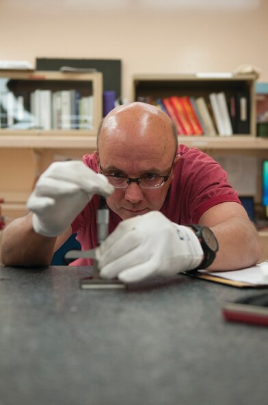 Arlen Gerdes, Precision Measurement Equipment Laboratory quality assurance, checks the accuracy of a micrometer depth gage to ensure the quality of PMEL’s work Nov. 14. The 90th Missile Maintenance Operations Squadron’s PMEL calibrates test equipment for units across F. E. Warren Air Force Base, Wyo., and the Wyoming Air National Guard. (U.S. Air Force photo by R.J. Oriez)