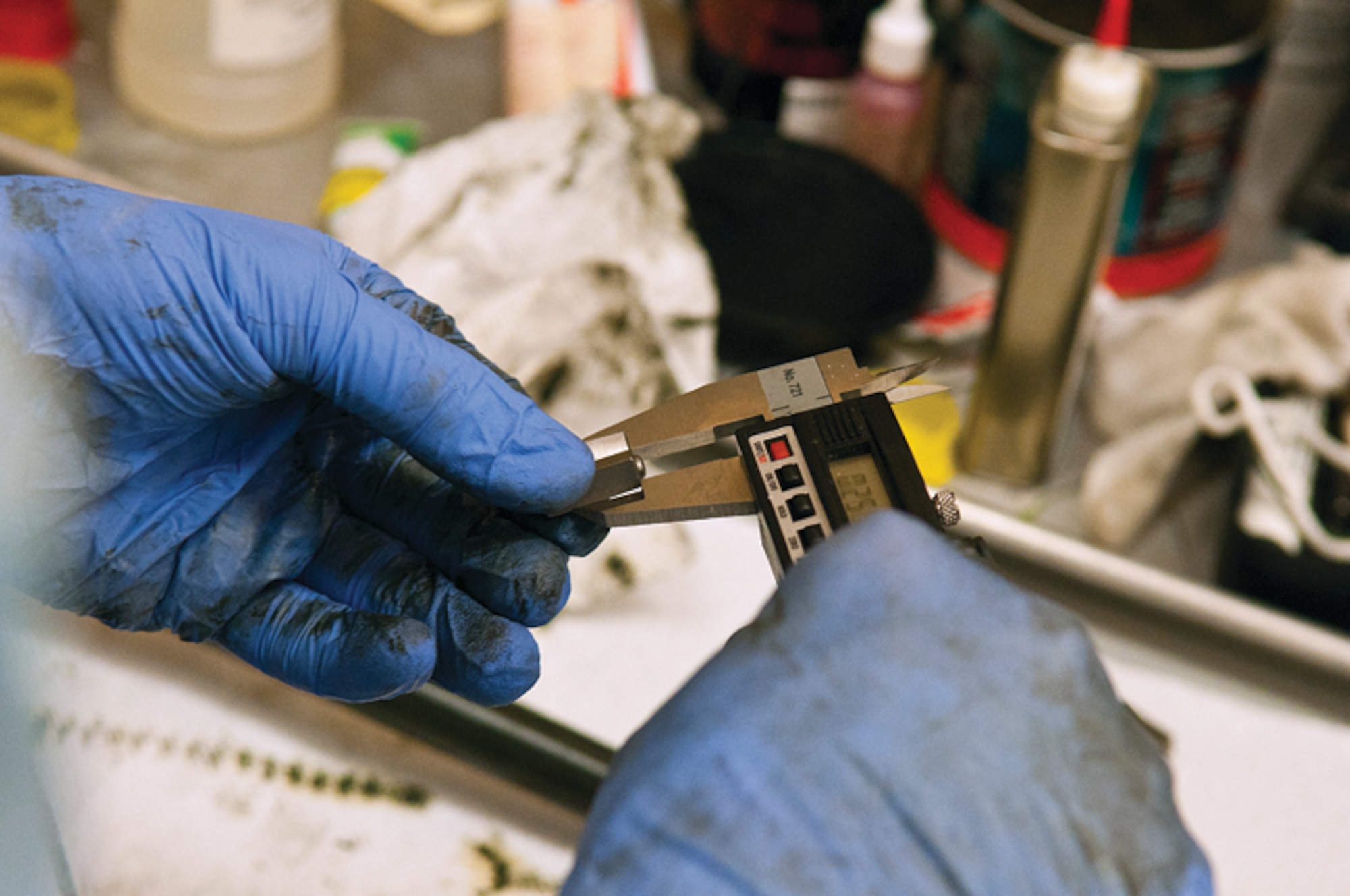 Tom Patton uses a micrometer to measure a piece used in the calibration of torque wenches at the Precision Measurement Equipment Laboratory on F. E. Warren Air Force Base, Wyo., Nov, 14. (U.S. Air Force photo by R.J. Oriez)