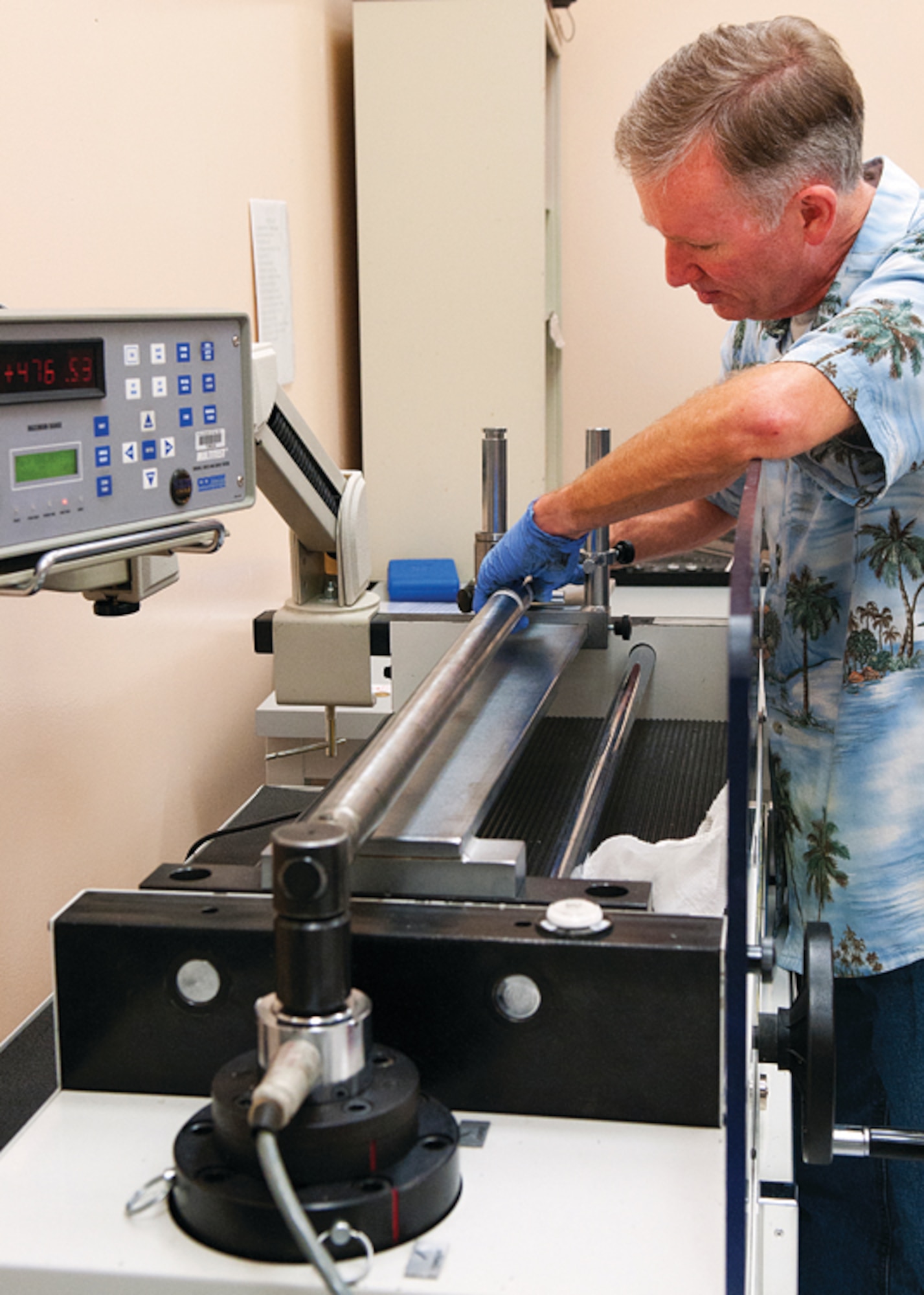Tom Patton positions a torque wench in a machine that will test its accuracy in the Precision Measurement Equipment Laboratory on F. E. Warren Air Force Base, Wyo., Nov. 14. (U.S. Air Force photo by R.J. Oriez)