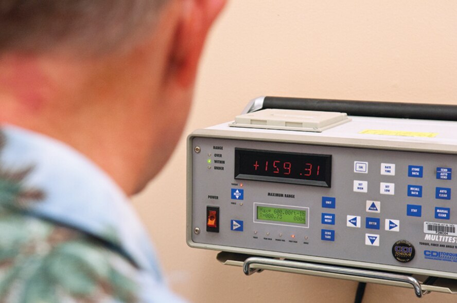 Tom Patton uses a micrometer to measure a piece used in the calibration of torque wenches at the Precision Measurement Equipment Laboratory on F. E. Warren Air Force Base, Wyo., Nov, 14. (U.S. Air Force photo by R.J. Oriez)
