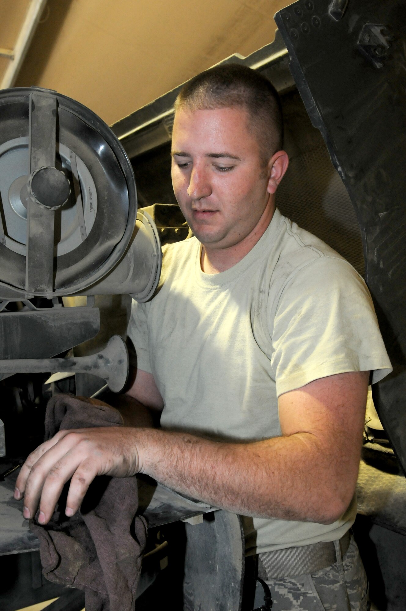SOUTHWEST ASIA - U.S. Air Force Staff Sgt. Ryan Zitnick, 380th Expeditionary Logistics Readiness Squadron aircraft refueling maintenance technician, cleans his hands after working on an OshKosh R-11 aircraft refueling vehicle Nov. 28, 2012. Zitnick, a Charleston, S.C., native is deployed from Charleston Air Force Base, S.C. (U.S. Air Force photo/Tech. Sgt. Amanda Savannah)