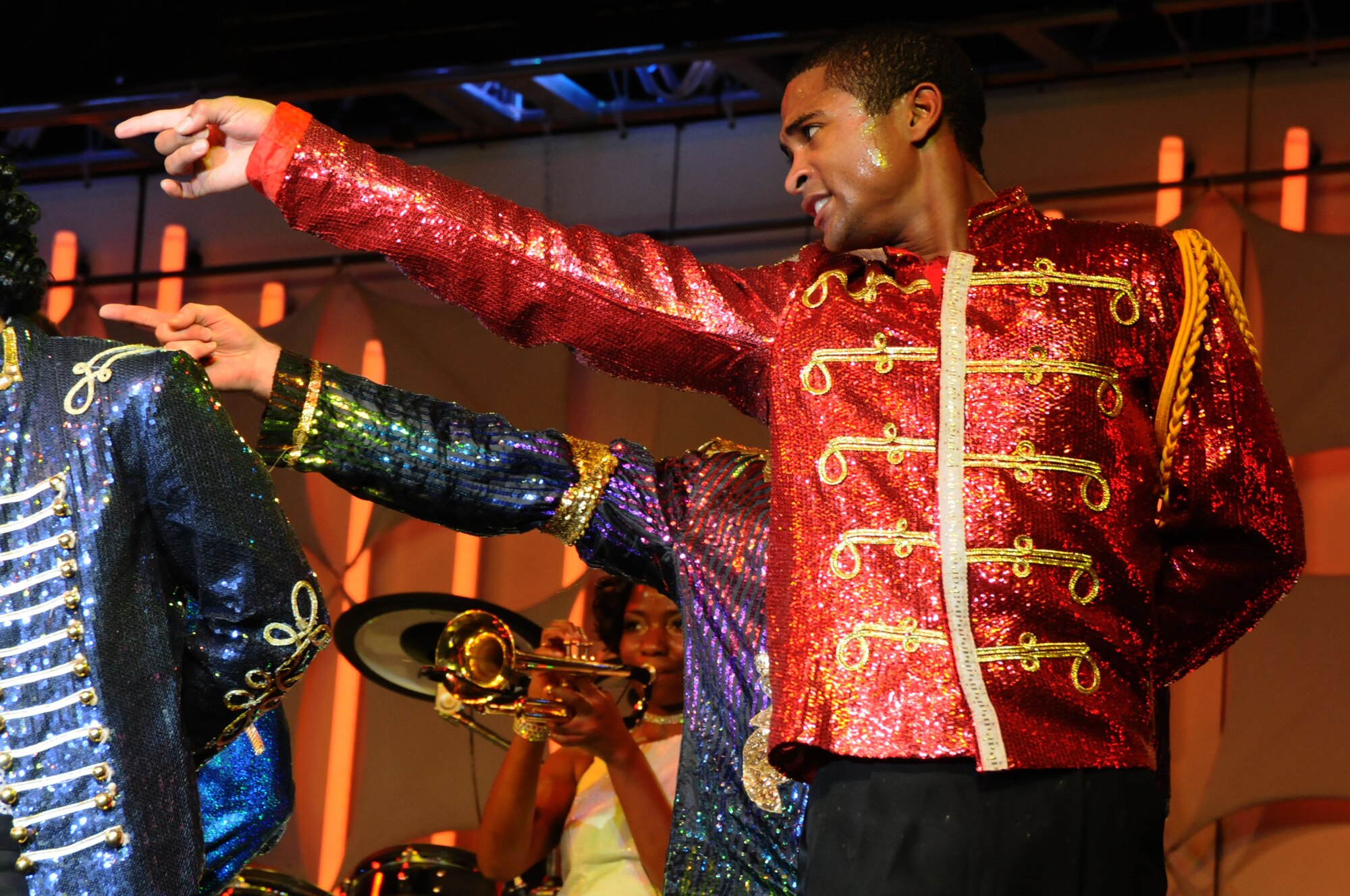 ANDERSEN AIR FORCE BASE, Guam – Senior Airman Charles Cooper, Tops in Blue vocalist, dances during a performance in Hangar 1 here Nov. 27. This year’s Tops in Blue performance, entitled “Listen,” is being performed throughout the United States as well as 20 countries worldwide. (U.S. Air Force photo by Senior Airman Carlin Leslie/Released)