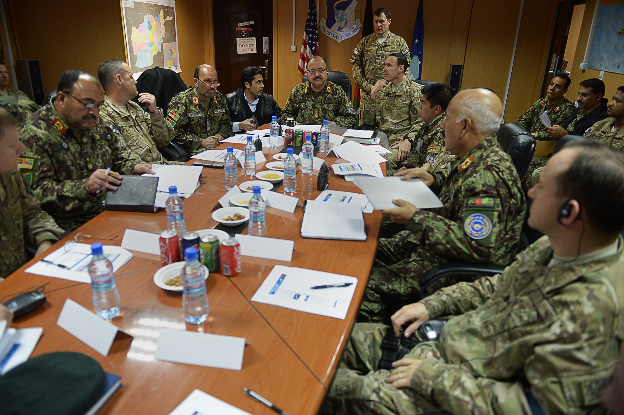 Senior staff of the Afghan Air Force and NATO Air Training Command-Afghanistan, joined by the Afghan AF air wings via video teleconference, witness and discuss the way ahead for 2012-13. Maj. Gen. Abdul Wahab Wardak, AAF commander, and Brig. Gen. Steven Shepro, NATC-A commander, signed the first-ever combined strategy Nov. 28, 2012 in NATC-A headquarters at the Kabul, Afghanistan, International Airport. The 54-page document committed both commands to action on jointly developed vision, goals and milestone timelines into 2013 and beyond in support of Afghan AF development. (U.S. Air Force photo/Tech. Sgt. Dennis Henry)