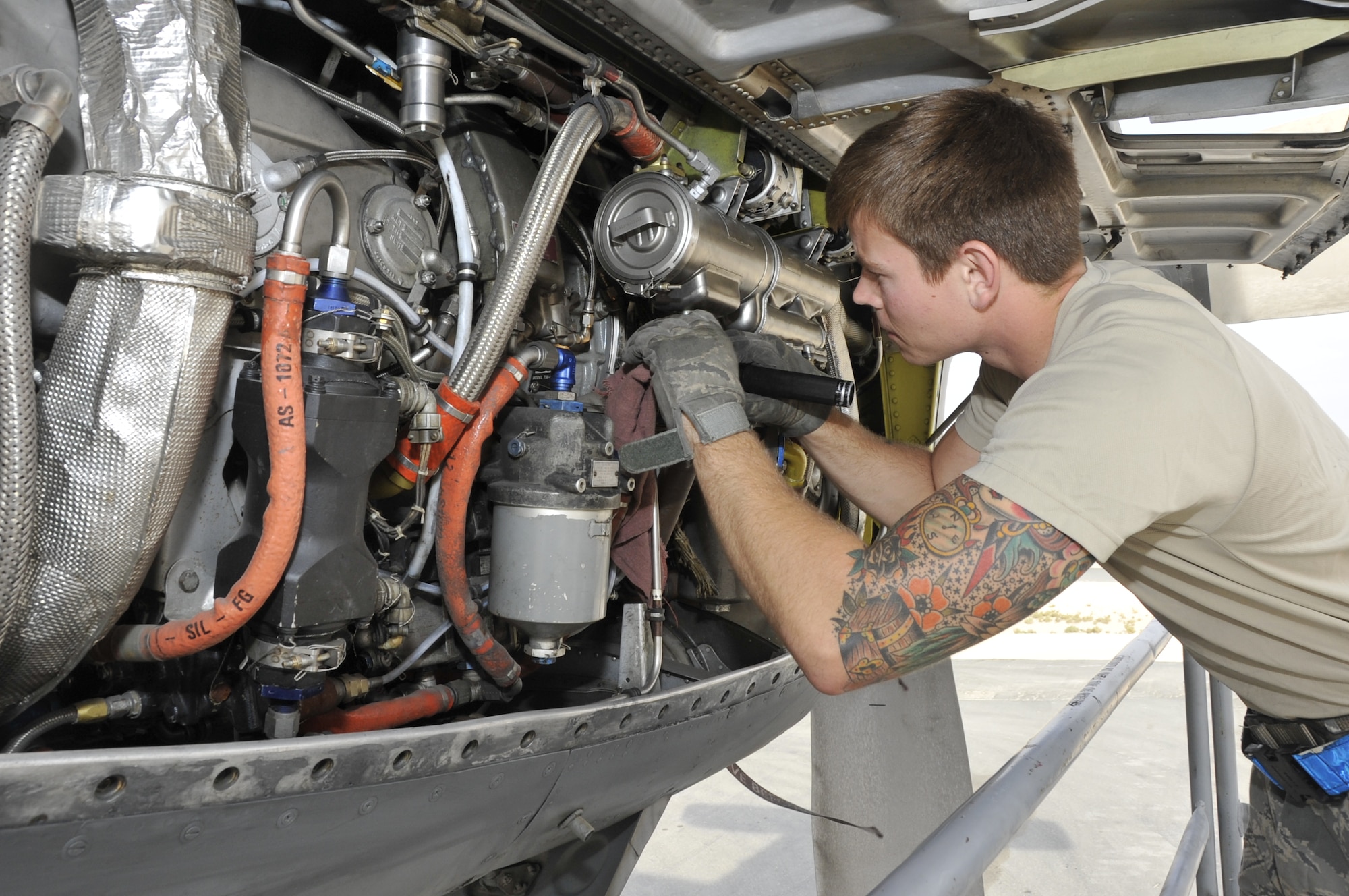 Senior Airman Zach Ellerman, 746th Expeditionary Aircraft Maintenance Unit crew chief, conducts a pre-flight inspection on the number four engine of a C-130 Hercules Nov. 27. Items like the magnetic drain plugs, fuel heater strainer and hydraulic filters are thoroughly inspected during every pre- and post-flight inspection to ensure serviceability. Ellerman is a member of the 746th EAMU crew chiefs deployed from Yakota Air Base, Japan. The team arrived to the 379th Air Expeditionary Wing in September and was responsible for the onward movement of more than 415 tons of cargo. Ellerman is a native of Rockwall, Texas. (U.S. Air Force photo/Senior Airman Bryan Swink)