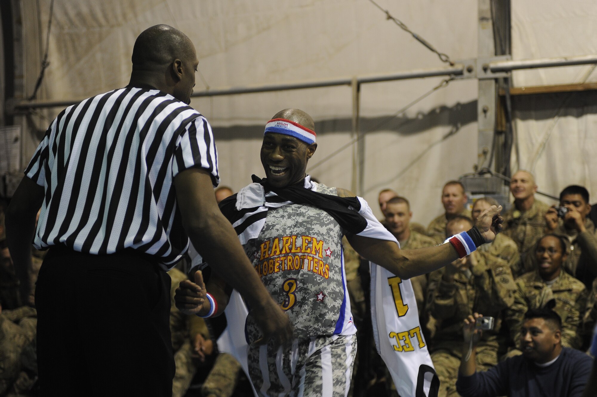 “Firefly” Fisher struts down the court with a newly-acquired uniform taken from the opposing team at Bagram Airfield, Afghanistan, Nov. 28, 2012. The visit was the first for the Globetrotters to Afghanistan, making it the 121st country and territory the team visited. (U.S. Air Force photo/ Master Sgt. Jun Kim)