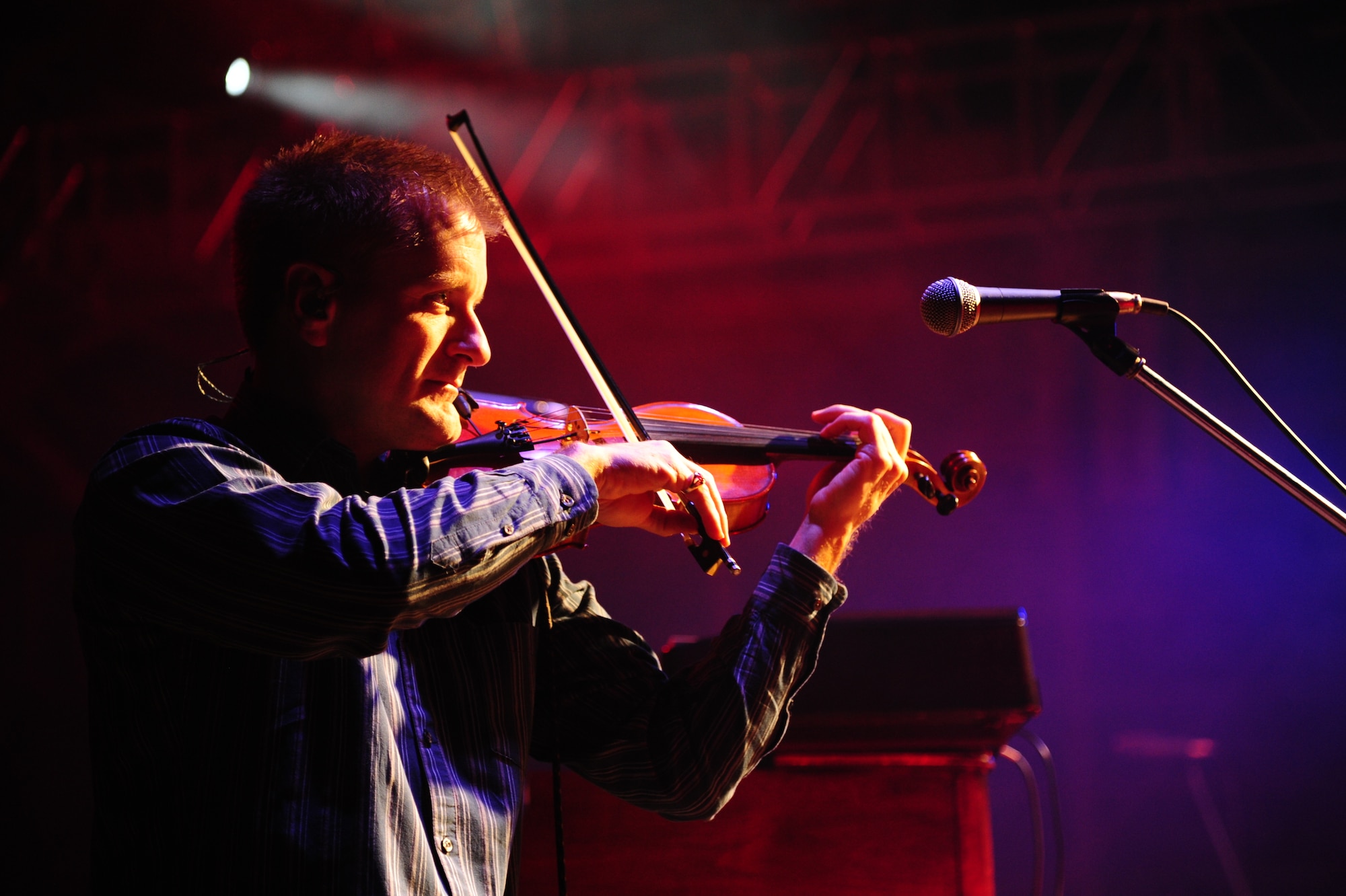 Paul Reissner, plays the fiddle as part of the Trace Adkins band at a USO-hosted concert at Misawa Air Base, Japan Nov. 28, 2012 for more than 1,000 service members and dependents. This is Adkins’ first time touring in Japan and his seventh USO tour in the past 11 years.  (U.S. Air Force photo by Staff Sgt. Jess Lockoski)