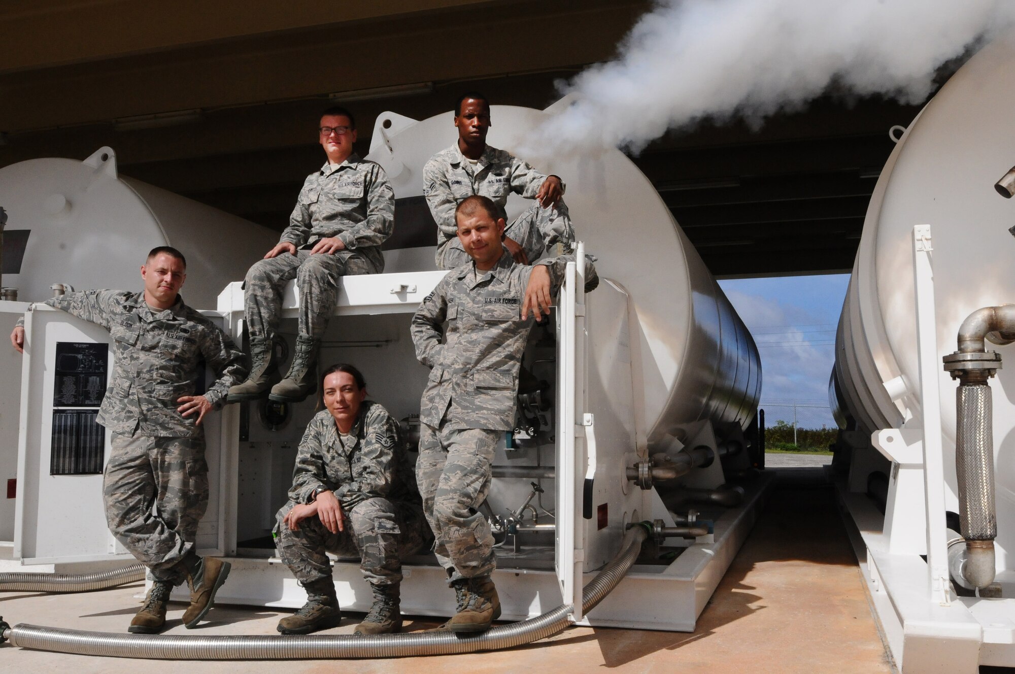 Airmen from the 36th Logistics Readiness Squadron’s fuels management cryogenics production element pose in front of a liquid oxygen storage tank here Nov. 29. Unique to a few locations in the Air Force, the team utilizes cryogenic technology to provide pure, clean breathing oxygen and clean, dry nitrogen in support of a multitude of units’ aviation, medical and maintenance needs. (U.S. Air Force photo by Senior Airman Carlin Leslie/Released)