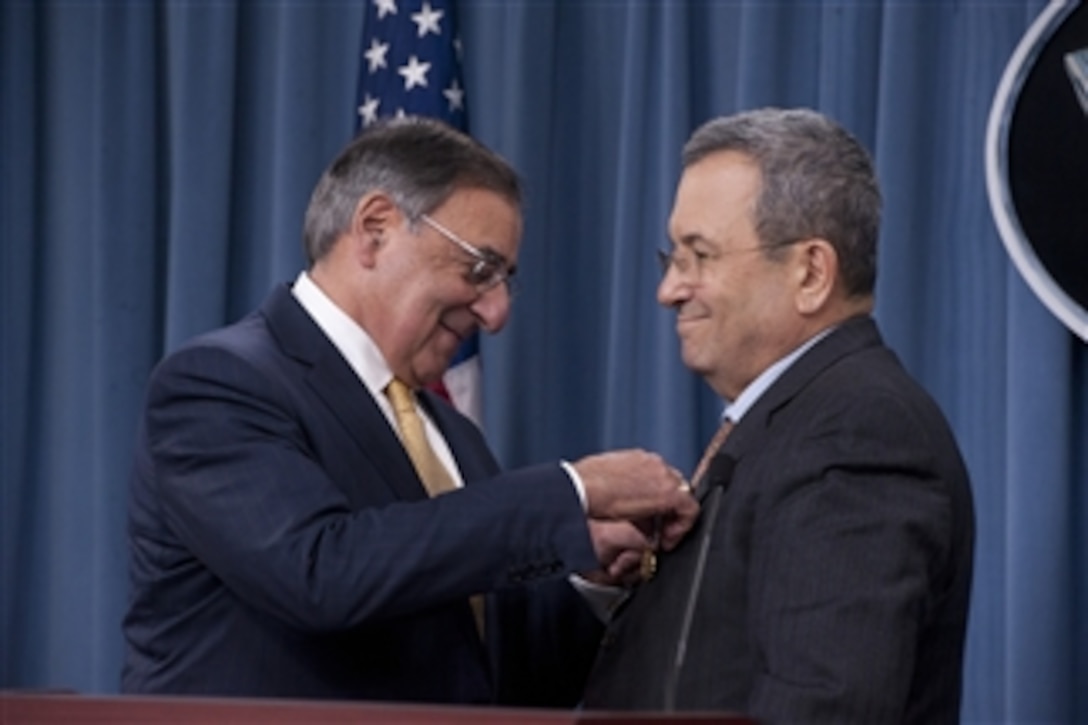 Secretary of Defense Leon E. Panetta, left, presents Israeli Minister of Defense Ehud Barak with the Department of Defense Medal for Distinguished Public Service during a joint press conference in the Pentagon on Nov. 29, 2012.  Panetta and Barack met earlier to meet to discuss national and regional security items of interest to both nations.  