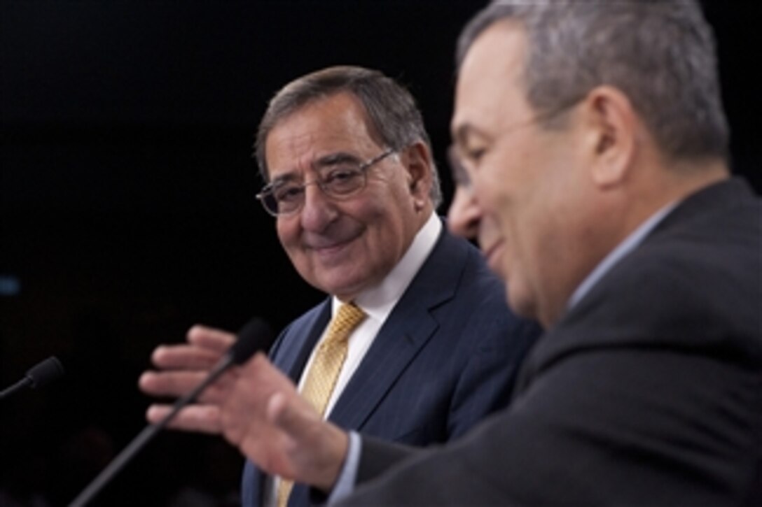 Secretary of Defense Leon E. Panetta, left, listens to Israeli Minister of Defense Ehud Barak during a joint press conference in the Pentagon on Nov. 29, 2012.  Panetta and Barack met earlier to meet to discuss national and regional security items of interest to both nations.  Panetta awarded Barack the Department of Defense Medal for Distinguished Public Service before taking questions from the press.  