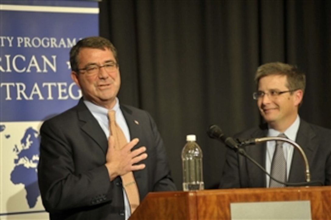Deputy Secretary of Defense Ashton B. Carter, left, thanks the audience after delivering his remarks at Duke University's Sanford School of Public Policy in Durham, N.C., on Nov. 29, 2012.  Carter was hosted by Dr. Peter Feaver, the director of the American Grand Strategy Program and Triangle Institute for Security Studies at Duke.  