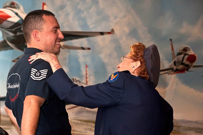 Betty Wall Strohfus, a WWII Women Airforce Service Pilot, speaks with Tech. Sgt. Jake Richmond, U.S. Air Force Aerial Demonstration Squadron "Thunderbirds", noncommissioned officer of community relations,  during a distinguished visit Sept. 27, 2012, at Nellis Air Force Base, Nev. Strohfus was stationed at Las Vegas Army Air Field from 1943-44, and was one of 1,074 women who became certified WASP pilots during WWII. Las Vegas Army Air Field later was re-designated as Nellis AFB.  (U.S. Air Force photo by Staff Sgt. Christopher Hubenthal)