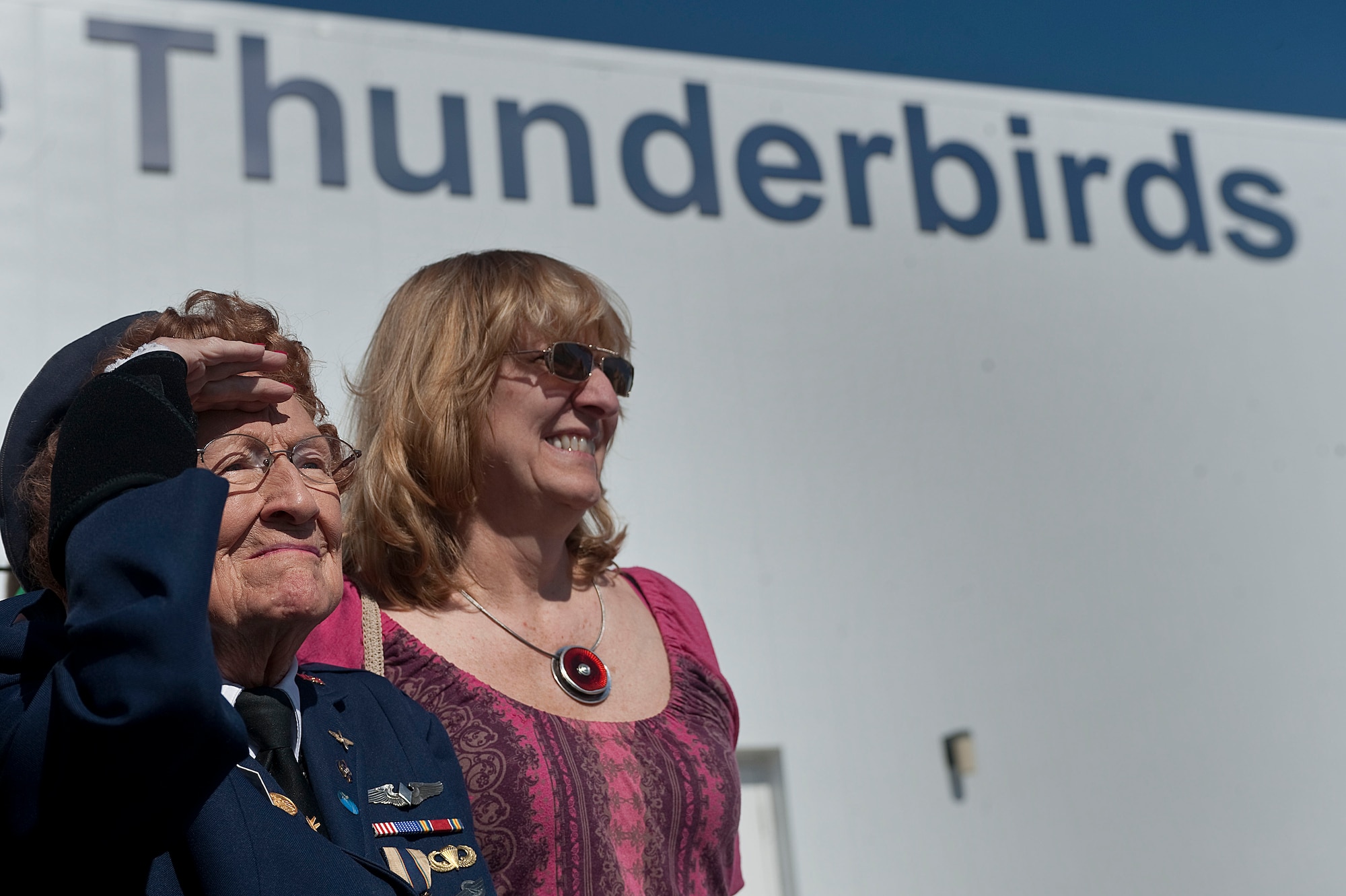 Betty Wall Strohfus, a WWII Women Airforce Service Pilot, and Julianne Reed, Strohfus' daughter, watch F-16 Fighting Falcons assigned to the  U.S. Air Force Aerial Demonstration Squadron "Thunderbirds," taxi during a distinguished visit Sept. 27, 2012, at Nellis Air Force Base, Nev. Strohfus visited with female pilots and support personnel assigned to the Thunderbirds during her visit to Nellis. (U.S. Air Force photo by Staff Sgt. Christopher Hubenthal)