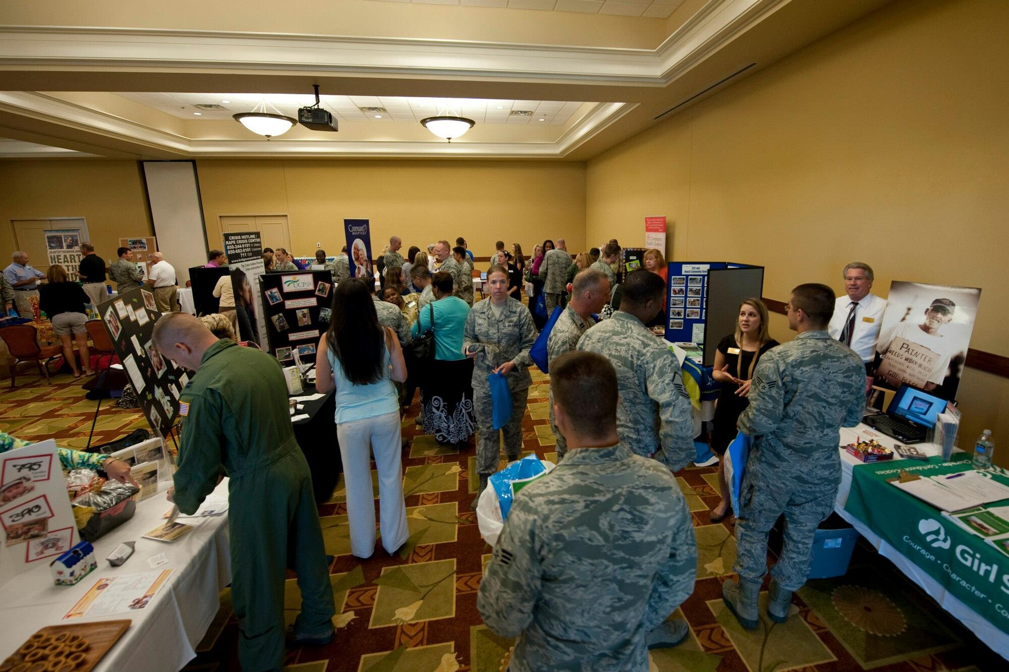 Dozens of Airmen met with various representatives from charities during the Combined Federal Campaign kickoff at the Soundside Club at Hurlburt Field, Fla., Sept 25, 2012. The charities boasted their programs with display booths, pamphlets, presentation boards and free marketing items. (U.S. Air Force Photo/Airman 1st Class Benjamin D. Kim)