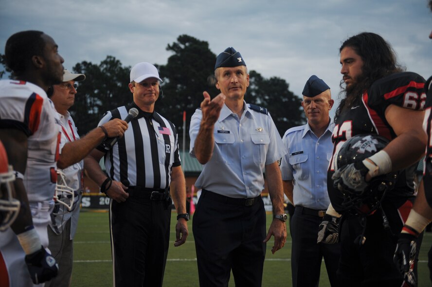 U.S. Air Force Col. Billy Thompson, 23d Wing commander, performs a coin toss during a football game at the Bazemore-Hyder Stadium in Valdosta, Ga., Sept. 29, 2012. The Valdosta State University Blazers won the coin toss and elected to receive the ball for the initial kickoff. (U.S. Air Force photo by Airman 1st Class Olivia Dominique/Released)