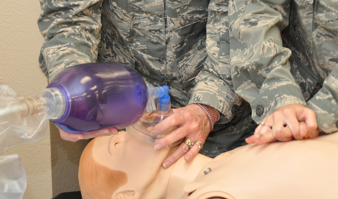 Capt. Angela L. Fountain, left, a nurse with the 944th Medical Squadron uses a bag valve mask to maintain an airway Laerdal SimMan 3G during a megacode while Senior Airman Lysa M. Busalachi, a medical technician with the 944th Aeromedical Staging Squadron performs cardiopulmonary resuscitation during an Advanced Cardiopulmonary Life Support class at the 944th ASTS simulation lab, Luke Air Force Base, Ariz., Sept. 9, 2012. (U.S. Air Force photo/Tech. Sgt. Phyllis E. Keith) 