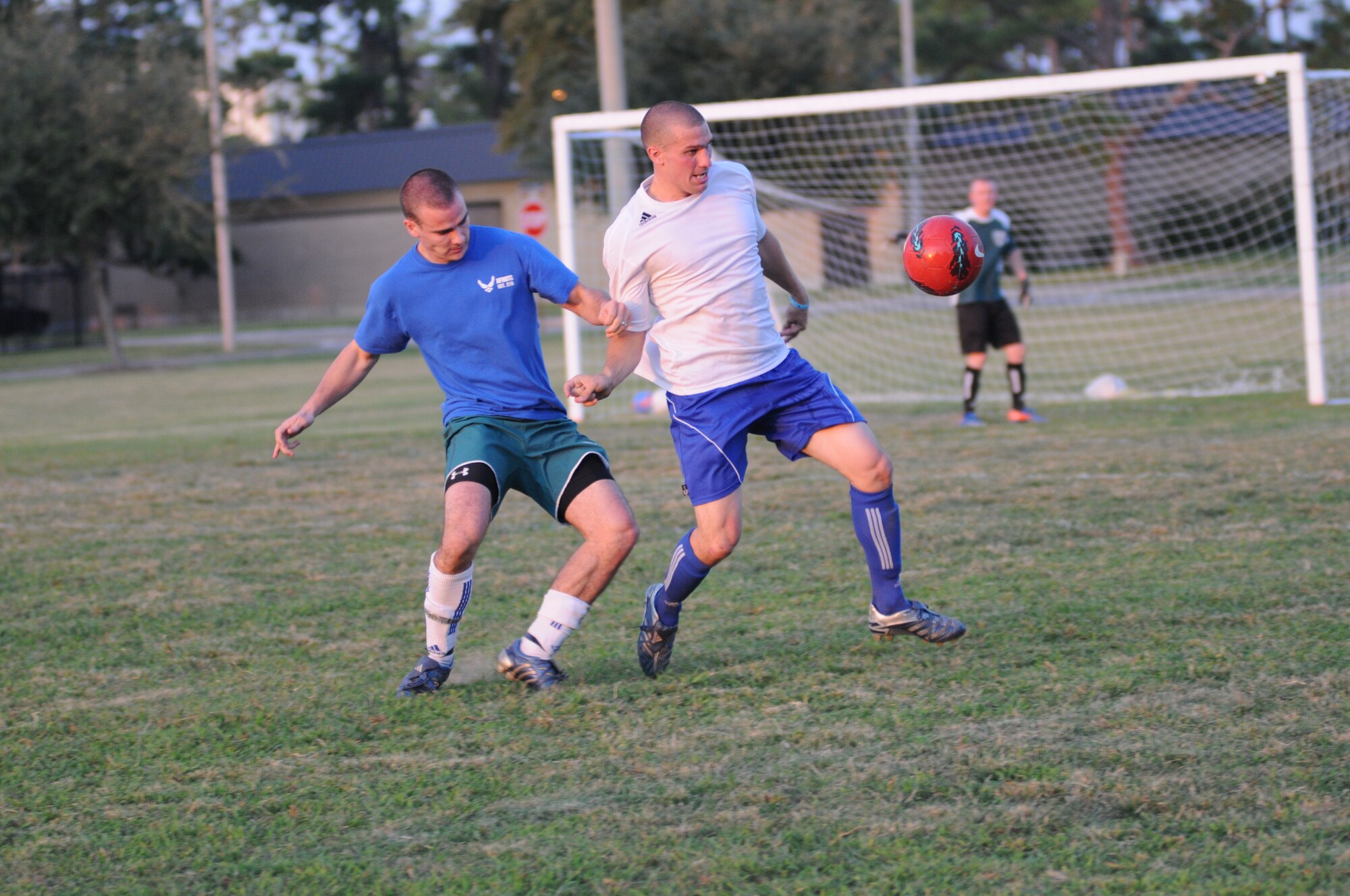 Matthew Neeld, 333rd Training Squadron, and Steve Bordelon, 334th Training Squadron, battle for the ball during the intramural soccer championship game Sept. 25, 2012, at Keesler Air Force Base, Miss.  The Gators defeated the Spartans 5-3.  (U.S. Air Force photo by Kemberly Groue)