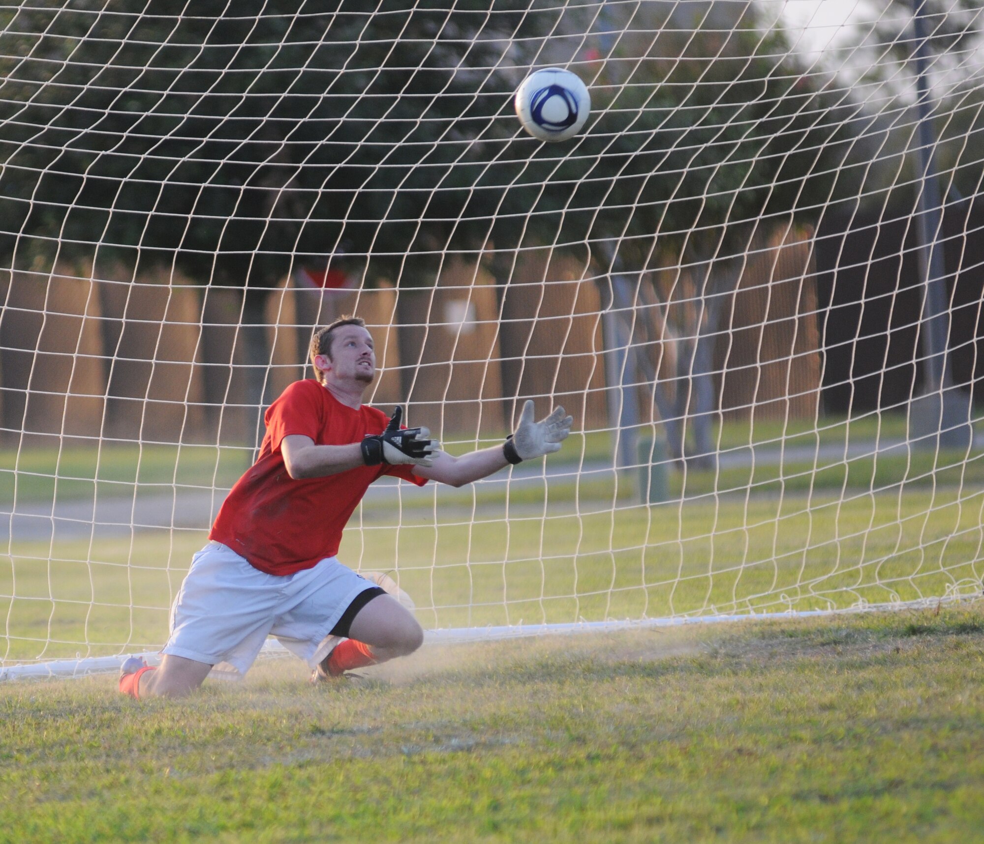 Kenny Woltz, 334th Training Squadron, positions himself to block the ball from entering the goal during the intramural soccer championship Sept. 25, 2012, at Keesler Air Force Base, Miss.  The Gators defeated the Spartans 5-3.  (U.S. Air Force photo by Kemberly Groue)