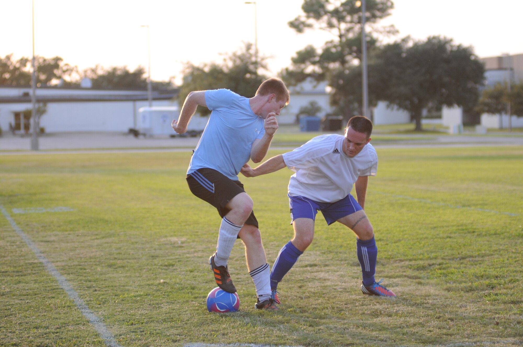 Daniel Votipka, 333rd Training Squadron, and Eric Hagan, 334th Training Squadron, battle for the ball during the intramural soccer championship Sept. 25, 2012, at Keesler Air Force Base, Miss.  The Gators defeated the Spartans 5-3.  (U.S. Air Force photo by Kemberly Groue)