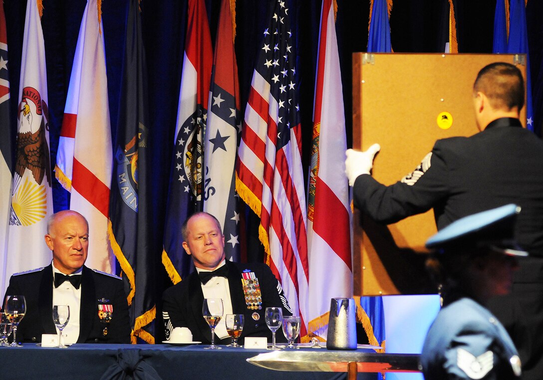 Lieutenant General Harry M. "Bud" Wyatt III, Director of the Air National Guard, and Air National Guard Command Chief Master Sergeant, Christopher E. Muncy, view the "Order of the Sword" proclamation.  Lieutenant General Wyatt was honored by the enlisted members from across the nation with the presentation of the "Order of the Sword", the highest award given by the Air Force enlisted force, for his distinguished career and outstanding achievements as Director of the Air National Guard.  The ceremony took place 28 September 2012, at the Hyatt Regency hotel, in Tulsa, OK. (Air National Guard photo by Master Sergeant Preston Chasteen/Released)