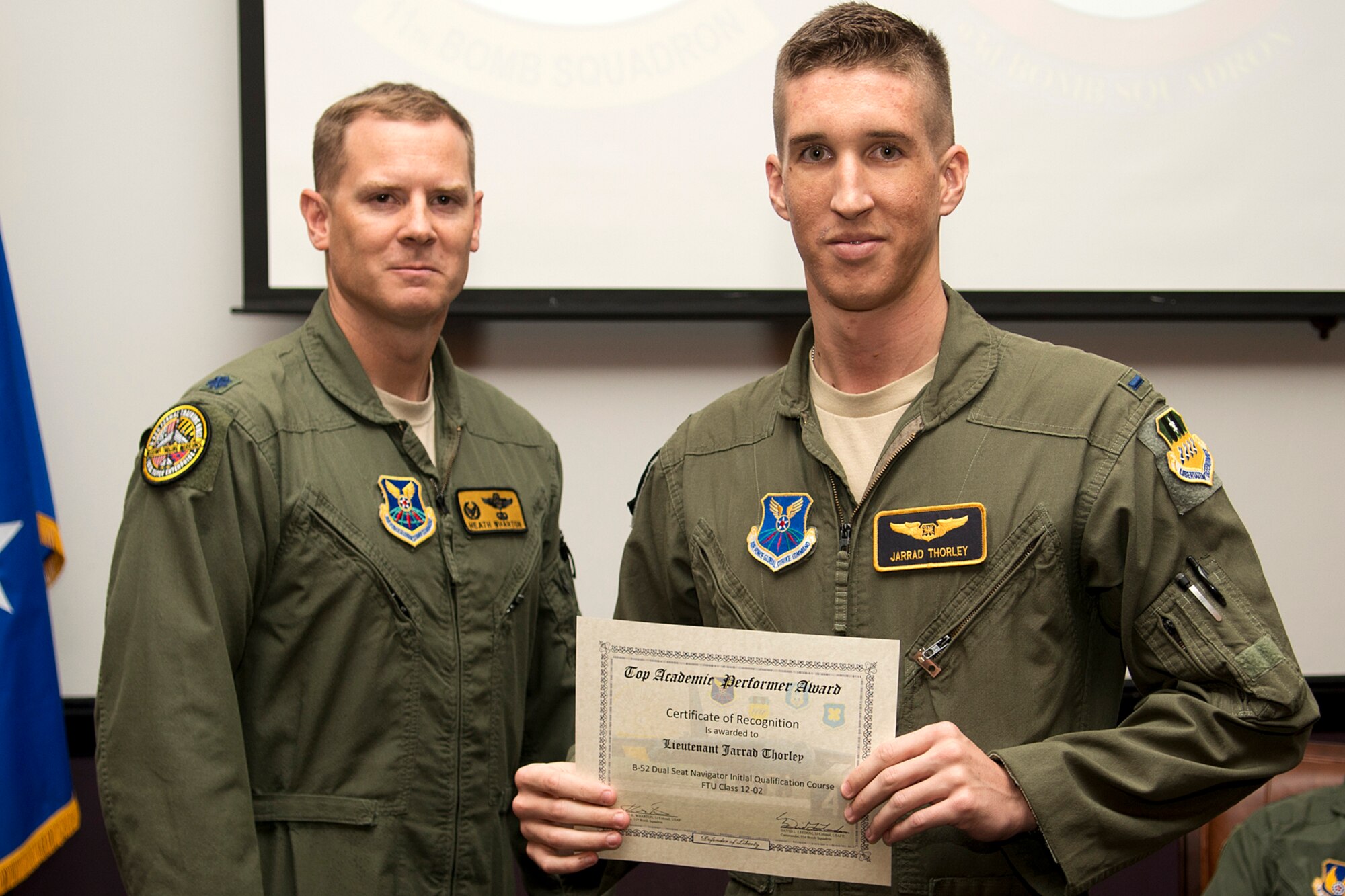 U.S. Air Force 1st Lt. Jarrad Thorley receives the Dual Seat Navigator Outstanding Academic Performer award during a B-52 Formal Training Unit Graduation ceremony, Sept. 28, 2012, Barksdale Air Force Base, La. Thorley achieved an overall academic average of 98.50 percent. (U.S. Air Force photo by Master Sgt. Greg Steele/Released)