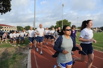 Joint Base San Antonio-Randolph members run the track during a running performance and injury program clinic held at the Randolph Fitness Center Sept. 27. Participants learned the importance of running mechanics and the effects of footwear on performance and injuries. (U.S. Air Force photo by Rich McFadden) 