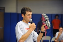 Mark Cucuzzella, a running performance and injury program educator, teaches Joint Base San Antonio-Randolph members about the importance of proper running footwear at the Randolph Fitness Center Sept. 27. Participants learned the importance running mechanics and how wearing proper running footwear improves performance and reduces the likelihood of running injuries.  (U.S. Air Force photo by Rich McFadden) 
