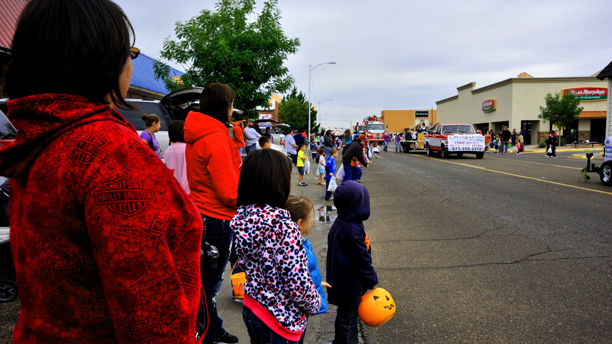 Members of the local community gather along the road in anticipation of Eastern New Mexico University’s homecoming parade in Portales, N.M., Sept. 29, 2012. Air Commandos from Cannon Air Force Base, N.M. came out in force to throw candy and reunite with their civilian neighbors. (U.S. Air Force photo/Senior Airman Whitney Tucker)
