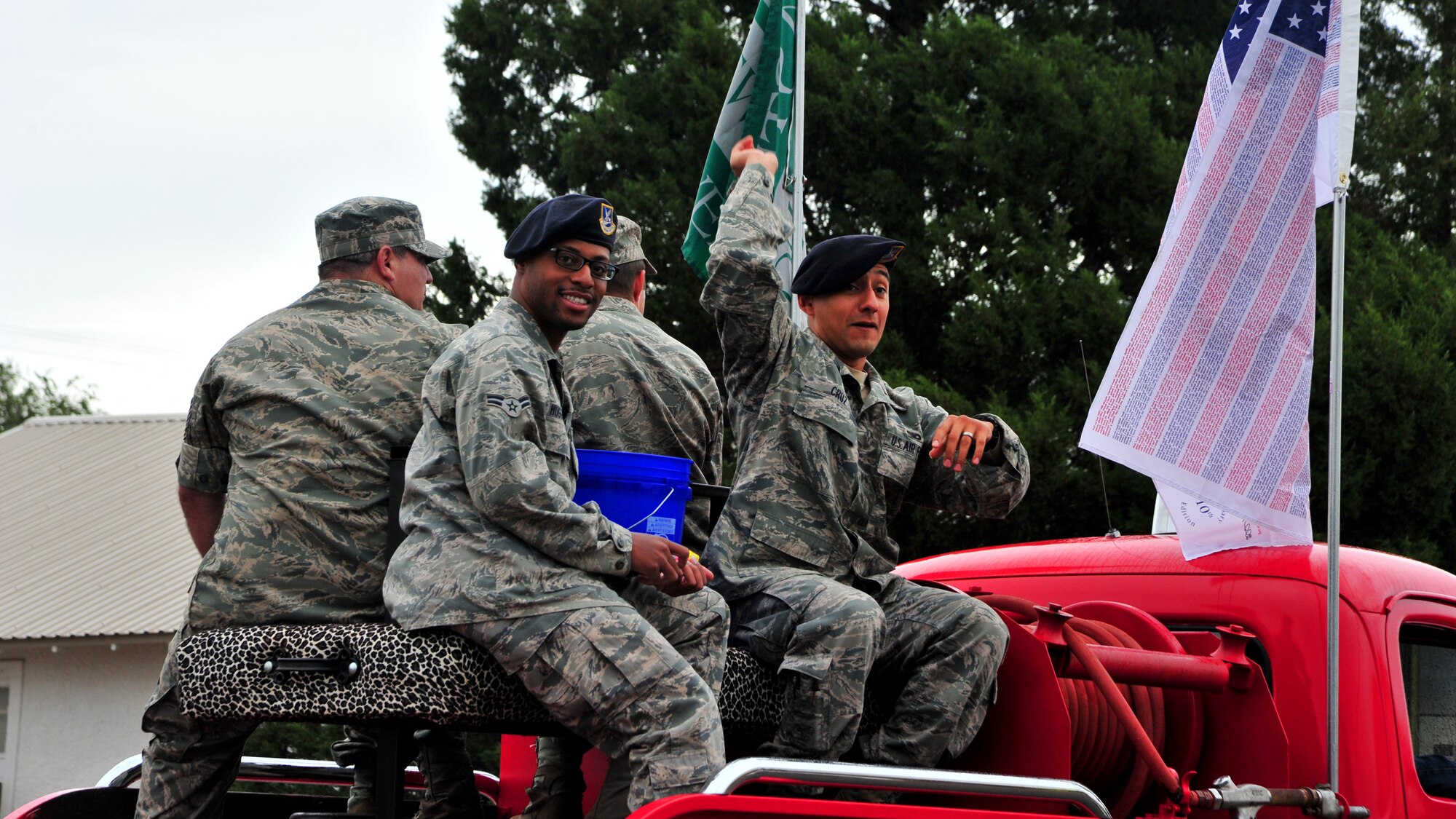 Air Commandos from Cannon Air Force Base, N.M., throw candy to members of the local community during Eastern New Mexico University’s homecoming parade in Portales, N.M., Sept. 29, 2012. Airmen mounted vintage automobiles, floats and fire engines to show their support for their civilian neighbors. (U.S. Air Force photo/Senior Airman Whitney Tucker)