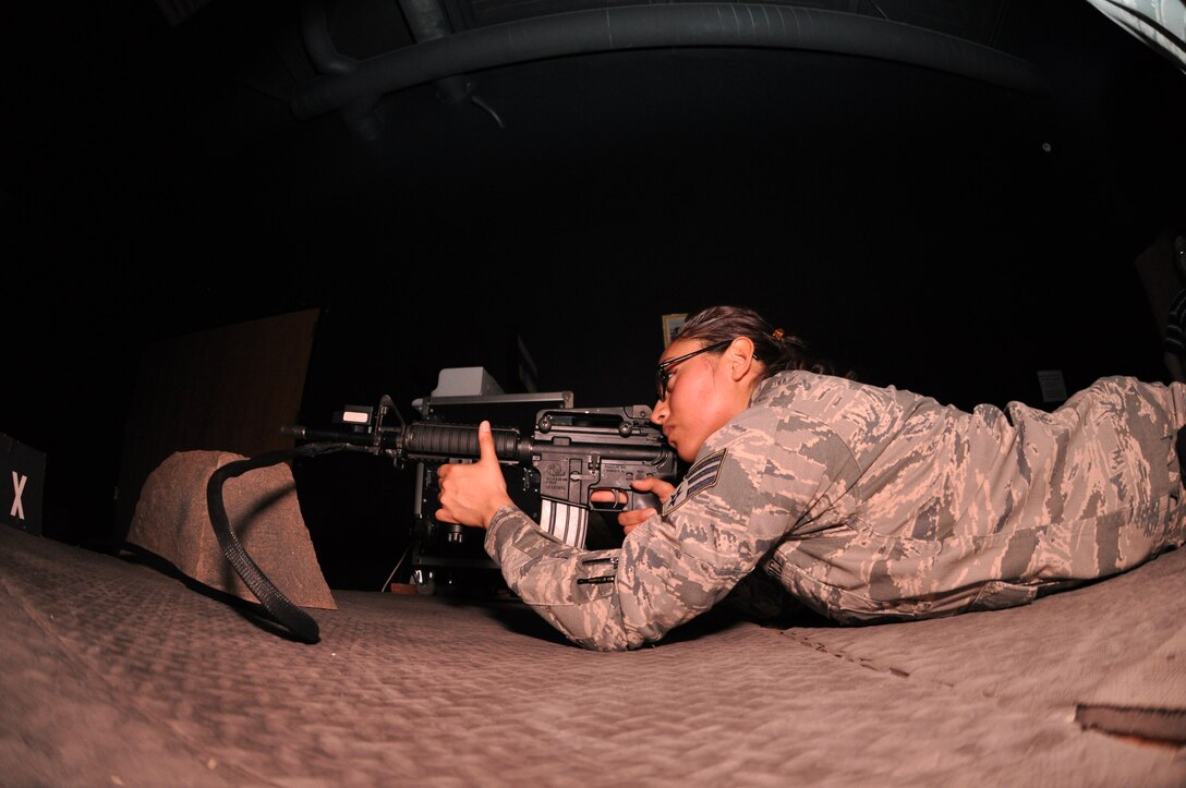 Senior Airman Senovia Gallegos a Traditional Reservist with the 477th Security Forces Squadron, trains on the Engagement Skills Trainer 2000 here. The EST 2000 offers a realistic alternative for training in marksmanship, collective and shoot/do not shoot scenarios on both the M-9 and the M-4. The 477th SFS stood up under the 477th FG here March 1. (U.S. Air Force Reserve Photo/Tech. Sgt. Dana Rosso) 

