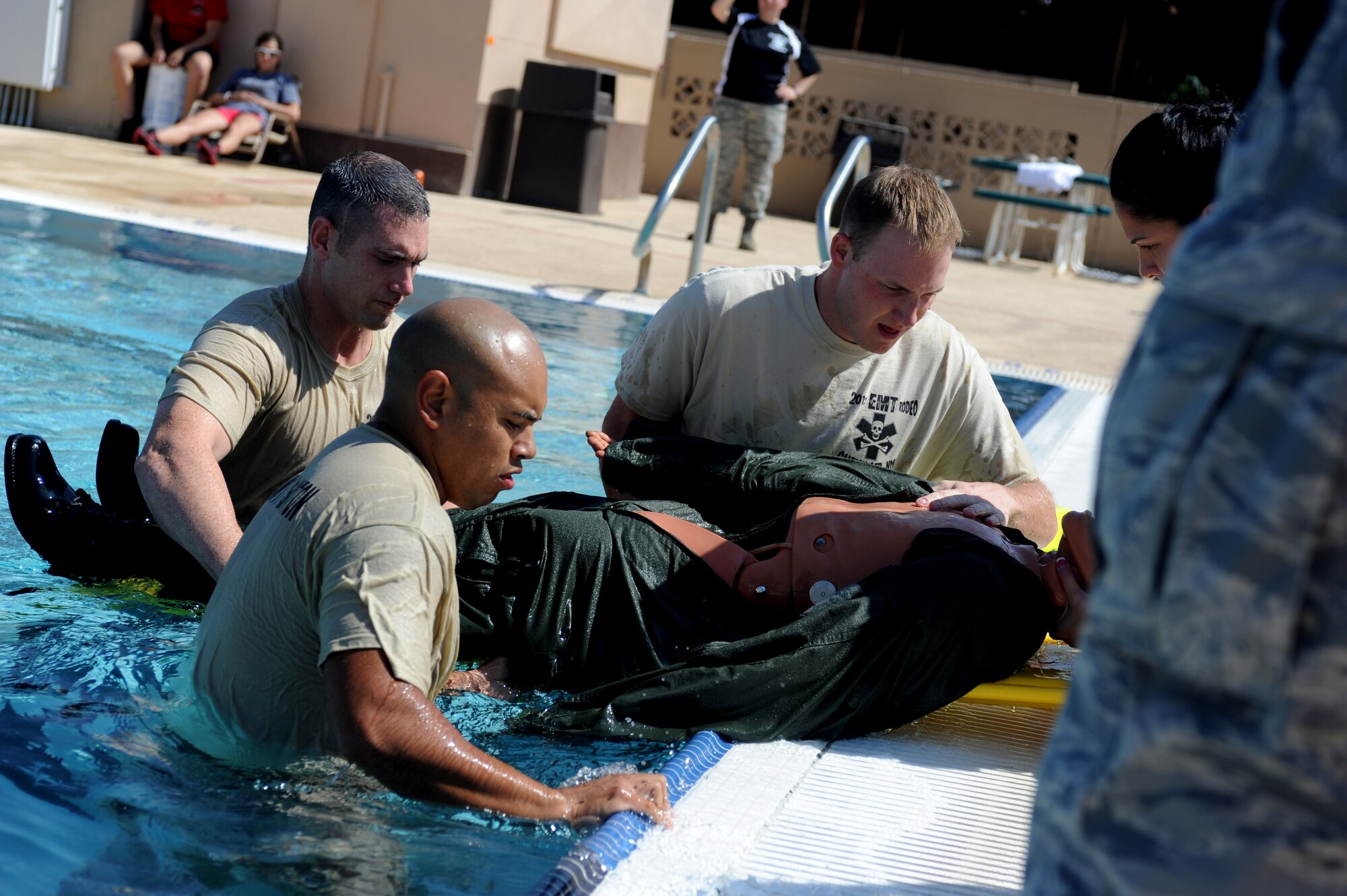 The emergency medical team from Fort Sam/Houston, Texas, rescues a dummy as part of the water extraction challenge during the Emergency Medical Technician Rodeo at Cannon Air Force Base, N.M., Sept. 21, 2012. The EMT Rodeo is a competition in which EMT teams from across the United States and Germany test their skills in various events that simulate real life scenarios. (U.S. Air Force photo/Airman 1st Class Xavier Lockley)