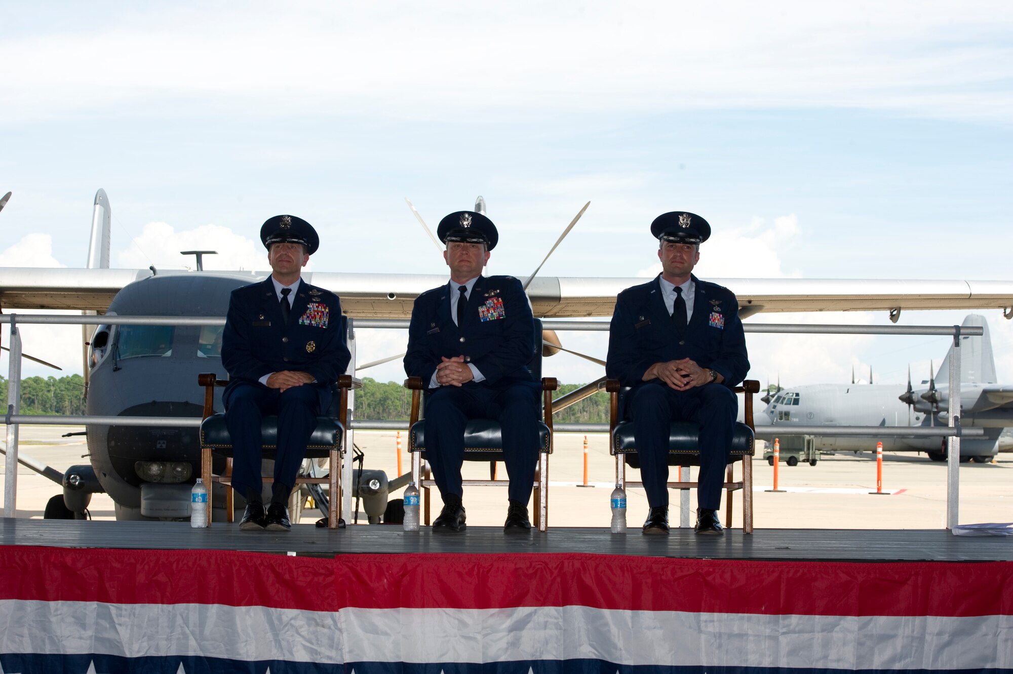 (From left to right) U.S. Air Force Col. Jim Slife, commander of 1st Special Operations Wing, Col. William Andersen, commander of Air Force Special Operations Training Center, and Lt. Col. Thomas Geiser, commander of 6th Special Operations Squadron, sit on stage during the 6th SOS transition ceremony at the Commando Hangar on Hurlburt Field, Fla., Sept. 28, 2012. The 6th SOS is relocating to Duke Field, Fla., and transferring command to the AFSOTC. (U.S. Air Force Photo/Airman 1st Class Naomi M. Griego)