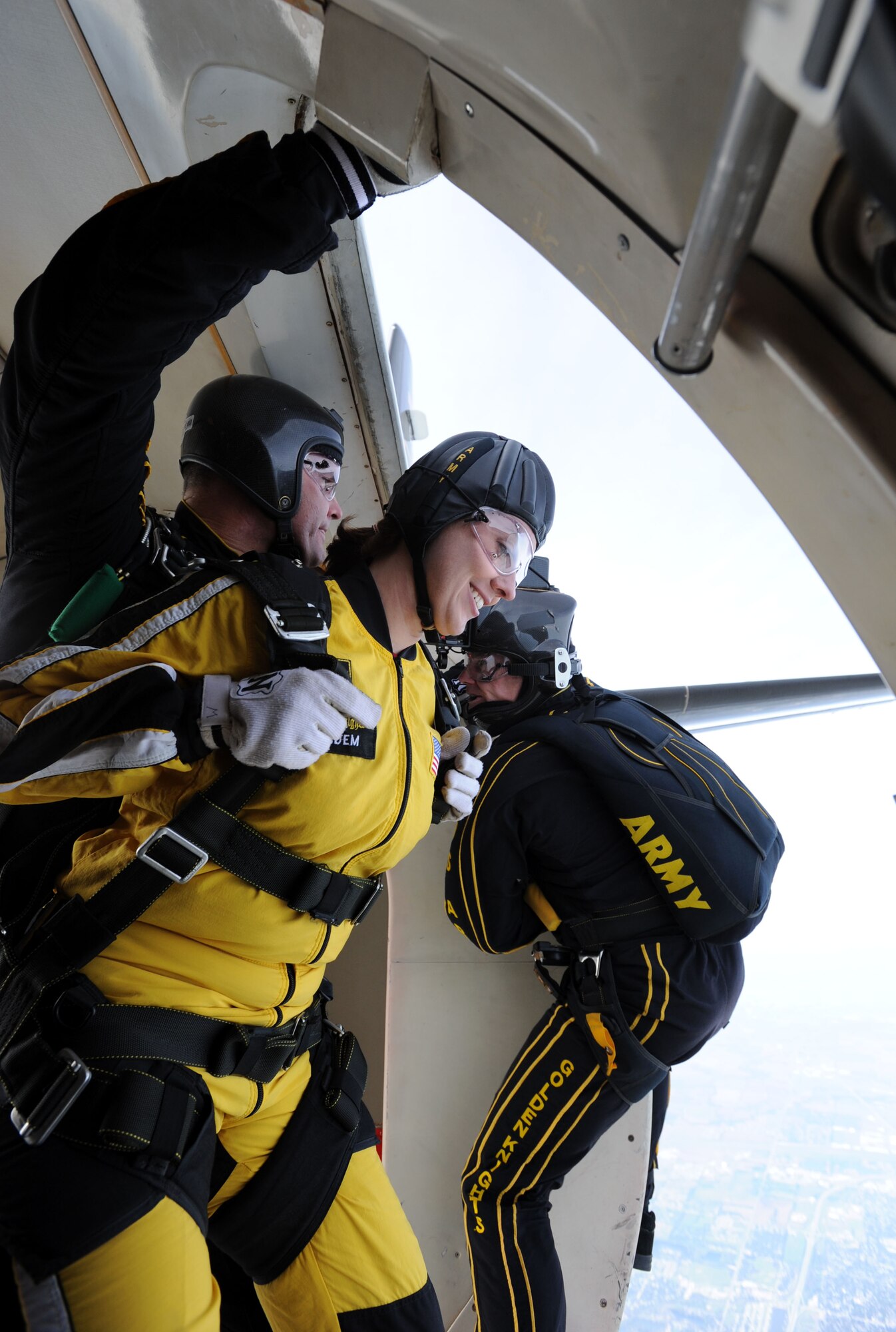 Seconds after exiting the aircraft, Amanda Chastain, 22nd Civil Engineer Squadron spouse, and U.S. Army Sergeant First Class Aaron Figel, U.S. Army Parachute Team assistant tandem team leader, begin the free-fall portion of their jump to McConnell Air Force Base, Kan. For more than 53 years, the U.S. Army Parachute Team, the Golden Knights, have performed precision free fall demonstrations to connect the U.S. Army with civilians (U.S. Air Force photo/Senior Airman Laura L. Valentine)