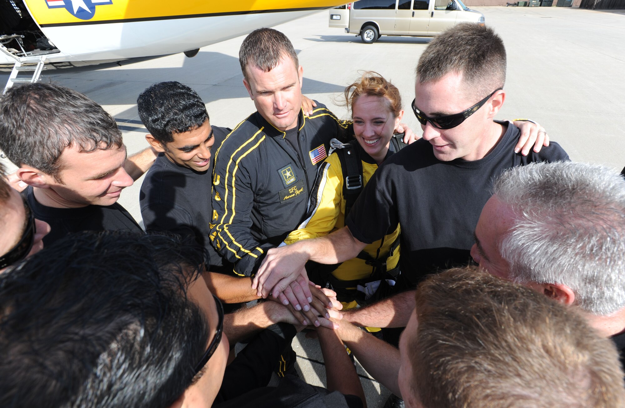 The U.S. Army Parachute Team, the Golden Knights, prepare for a morning demonstration for the crowd at 2012 Wings over McConnell open house and air show. Amanda Chastain, 2012 Joan Orr Air Force Spouse of the Year award winner, joined the U.S. Army Golden Knights for a tandem jump Sept. 29, 2012. (U.S. Air Force photo/Senior Airman Laura L. Valentine)