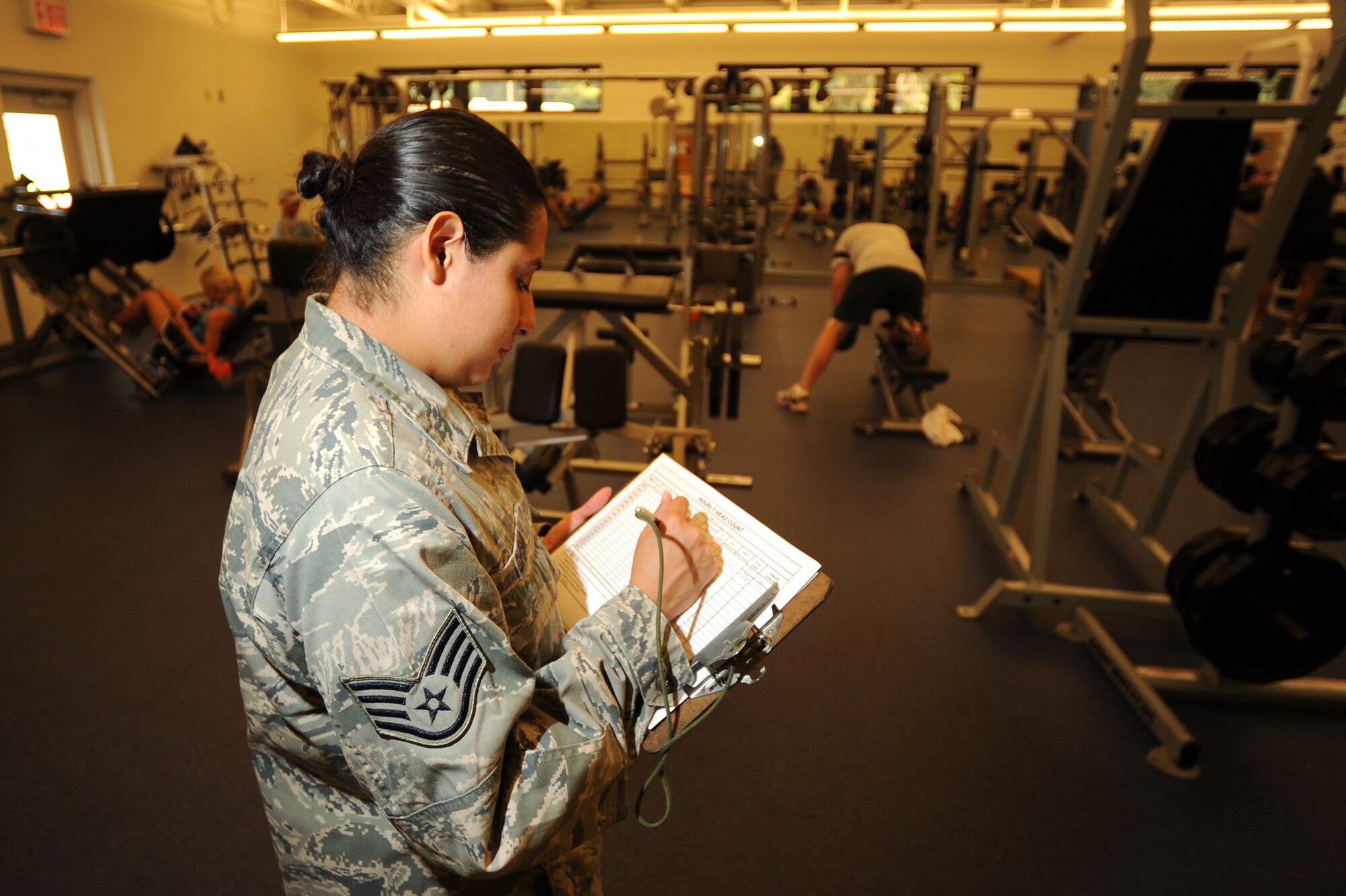 Staff Sgt. Laura Chism, a services craftsman of 1st Special Operations Force Support Squadron, takes a head count of a weight room at the Aderholt Fitness Center at Hurlburt Field, Fla., Sept. 26, 2012. The services airmen working at the fitness center ensure a clean and safe environment for service members to workout. (U.S. Air Force photo by Senior Airman Eboni Reams)

